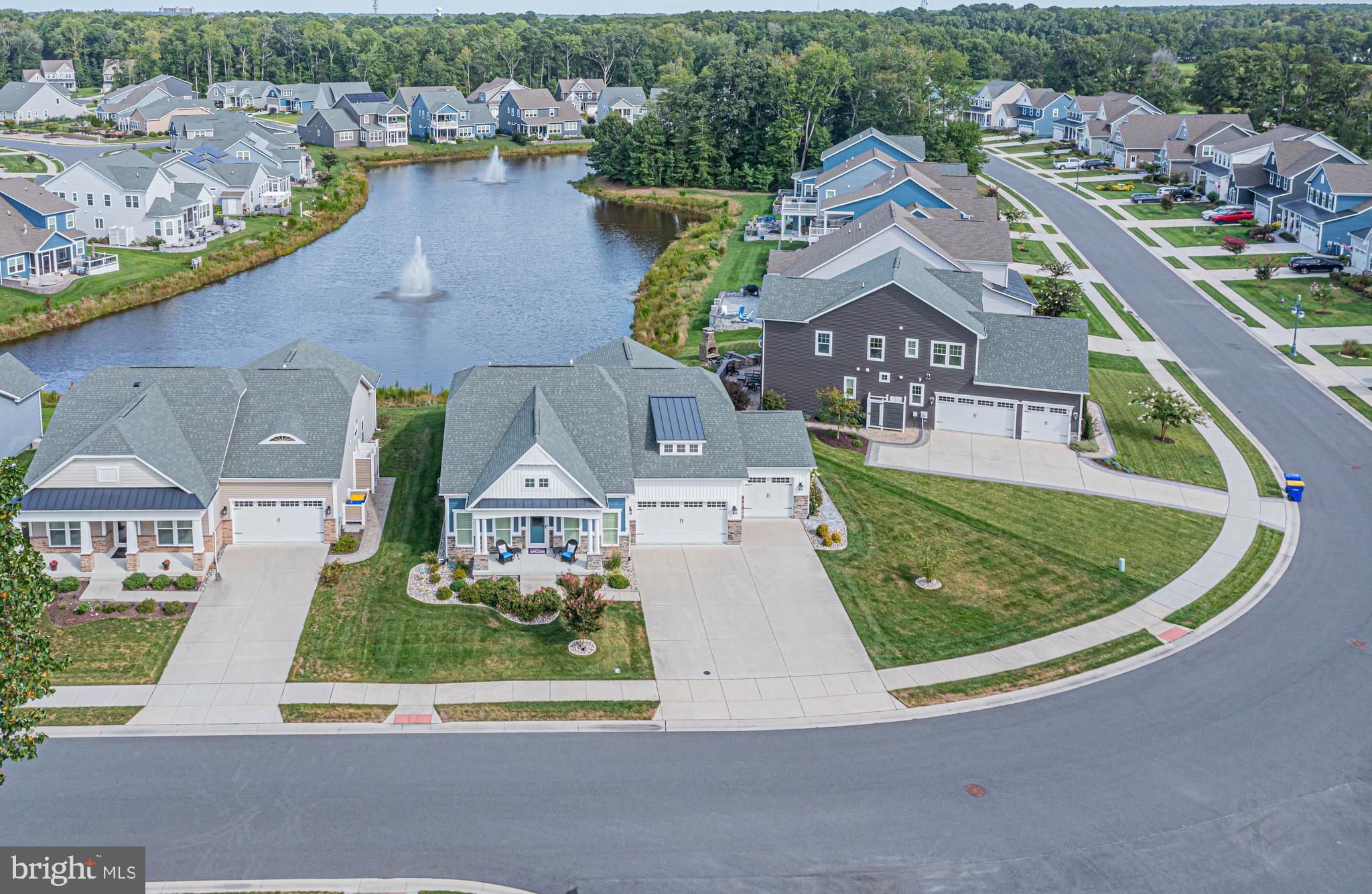 Welcome to this stunning 4-bedroom, 3-bath pond-front home in the desirable Reserves community of Ocean View, Delaware. Designed for both comfort and convenience, this property features a spacious 3-car garage, dual laundry areas (one upstairs and one downstairs), and a large outdoor shower with a private dry area. The gourmet kitchen is equipped with premium Monogram appliances, quartz countertops, and elegant finishes throughout. Additional highlights include a conditioned crawl space and a high-efficiency 2-zone heat pump with gas backup. Residents of the Reserves enjoy resort-style amenities including an outdoor pool, fitness center, community clubhouse, and bocce ball courts—all just minutes from the beaches of Ocean City and Bethany. Furnishings are negotiable