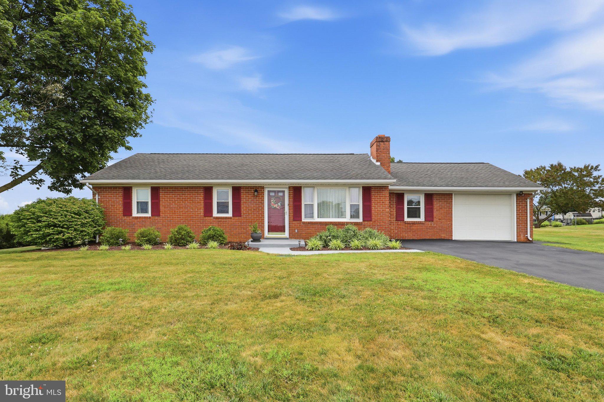 This beautiful all-brick rancher offers the perfect combination of peaceful country living and everyday convenience. Situated on a level 0.57-acre lot with scenic mountain views, this property has been lovingly cared for by the same owners for more than 40 years. Move-in ready and meticulously maintained!

Inside, you'll find 3 bedrooms, 2 bathrooms, and two levels of living space. The remodeled kitchen features quality cabinetry, a center island, updated appliances, and plenty of workspace for cooking and entertaining. Beautiful hardwood floors, replacement windows, an updated HVAC system, and numerous additional improvements make this home shine. The oversized attached one-car garage is super clean and right off the large mud room that offers additional storage and a pantry.

The lower level offers exceptional flexibility with abundant space that provides excellent future expansion potential, a large laundry room complete with a convenient laundry chute from the main level, built-in shelving, storage bins. and plenty of room for storage and a workshop. 

Step outside and enjoy the beautifully landscaped yard, covered patio, and inviting outdoor living area—perfect for relaxing while taking in the peaceful mountain views. A secure storage shed provides ample room for lawn equipment, tools, and additional storage.

Additional improvements include updated septic components with newer septic lines and a distribution box, providing added peace of mind. All kitchen appliances, along with the washer and dryer, UV light and water softener, convey with the sale.

Conveniently located on N. Hilltop Acres, this home offers a quiet rural setting while remaining just minutes from shopping, restaurants, schools, medical facilities, and easy access to both I-81 and I-70 for an easy commute.

Homes that have been maintained with this level of pride are a rare find. Schedule your private showing today!