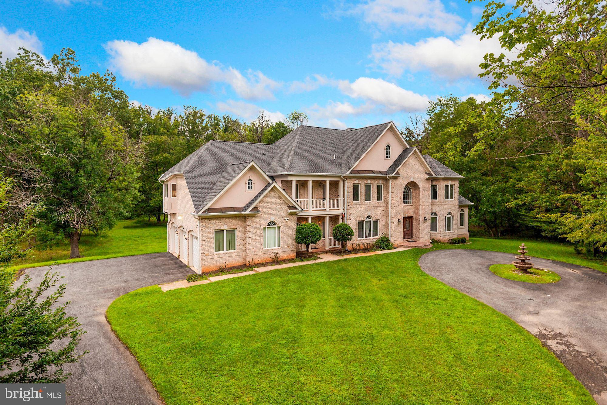 NEW PRICE & OPEN SUNDAY 1/10, 2-4PM! Wonderfully located just minutes to Potomac Village, 10323 Oaklyn Dr is an elegant and well-appointed estate situated at the end of a private driveway which as just been resurfaced on 2.1 acres. This home is ideally surrounded by parkland, highly acclaimed schools, and the neighborhood swim and tennis club is within close proximity. Offering a tranquil and a serene setting, this expansive haven is your perfect sanctuary. 10323 Oaklyn Drive is a classically beautiful residence showcasing 7 Bedrooms and 6.5 Baths throughout 3 finished floors. Spanning approximately 9,300 finished square feet, this timeless estate has been dressed with gleaming hardwoods, custom millwork, and a flowing floor plan made for large-scale entertaining. A home with generous proportions and warm character, 10323 Oaklyn Drive is here to suit nearly every lifestyle.   The inviting Two-Story Foyer with a marble floor and sparkling chandelier is flanked by the formal Living Room and Dining Room. The gracious Living Room and its adjacent Sunroom share a double-sided gas Fireplace. The Dining Room has a tray ceiling with cove lighting and accent molding. Double doors open to the Study that also connects to the Sunroom. Just past these formal spaces is the incredible Family Room with a 19? ceiling, floor-to-ceiling windows, and a gas fireplace. Complete with ample cabinetry, granite counters, a large center island, the generous Kitchen also features an adjoining Breakfast Area that opens to the Rear Deck. A Butler?s Pantry with a Wet Bar is excellent for large parties and is nestled off the Dining Room. There is a Main Level Bedroom with an En-Suite Bath that may also be used as an additional Home Office, Home Classroom, or Creative Space. A second entrance with a Covered Porch welcomes you into the Mud Room that also has access to the attached 3-Car Garage.  There are 5 Bedrooms and 4 Full Baths on the Upper Level including a stunning Primary Suite. The Primary Suite encompasses a Sitting Room that shares a Double-Sided Fireplace with the Bedroom and a huge walk-in closet. The spa-like Primary Bath has a luxurious soaking tub and separate vanities. Bedrooms 2 and 3 have En-Suite Baths and walk-in closets. Bedrooms 4 and 5 share access to a Covered Balcony. There is one Full Bath in the hall. A Laundry Room is on this Bedroom Level for convenience.  The Lower Level is ready for a number of activities and is comprised of a spacious Recreation Room, Gas Fireplace, Wet Bar, Game Room, Exercise Room, a Bedroom Suite with a Full Bath, and a potential Home Theater. The Walkout Lower Level opens to a rear Patio that is highlighted by unobstructed views of the lush grounds.