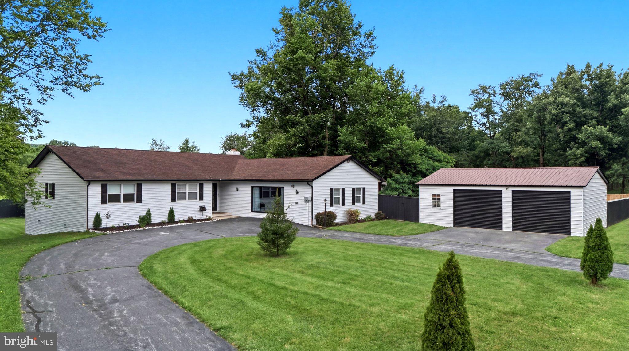 This charming ranch-style home in Golden Meadows offers a spacious 2,994 sq. ft. layout on a generous 2.42-acre lot. The interior features an open floor plan with a cozy family room off the kitchen, three bedrooms, and two full baths, including a primary bath with modern amenities. Enjoy the warmth of three gas fireplaces and the convenience of main-floor laundry. The kitchen boasts an island and down-draft cooktop, perfect for culinary enthusiasts. Outside, the property includes a detached oversized garage and a shed, complemented by a scenic vista of pastures. The cleared front and rear yards provide ample space for outdoor activities. Located in a welcoming community. Experience the tranquility of rural living while remaining close to essential public services.