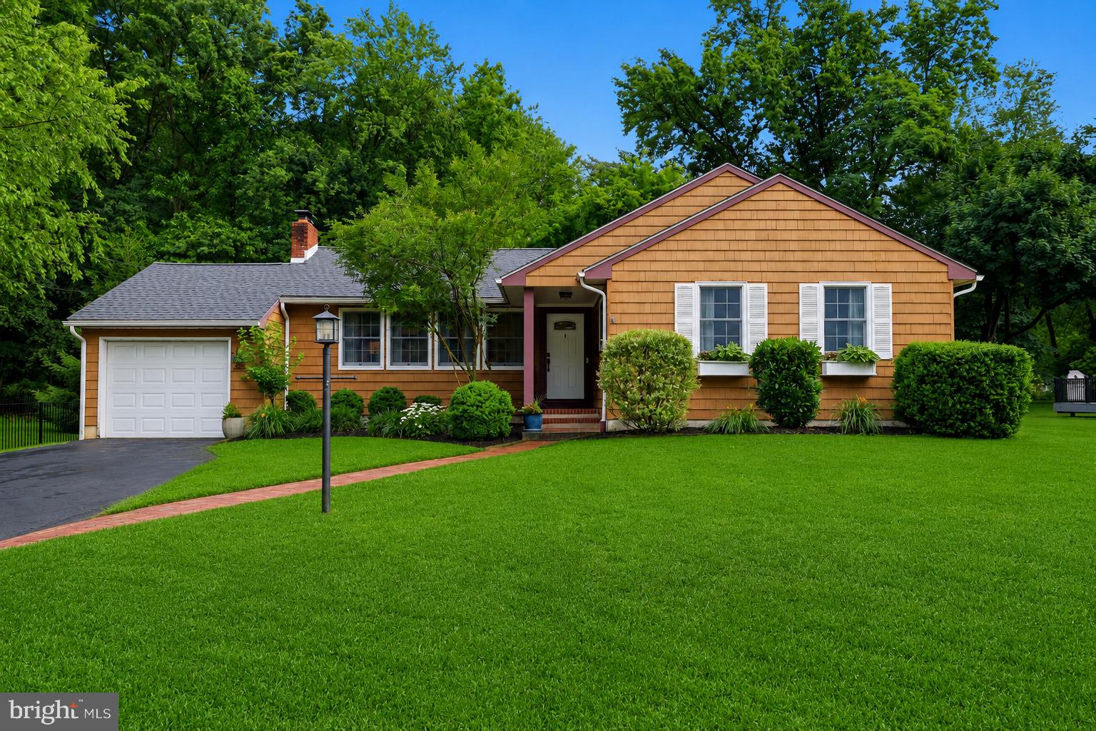 Showings start 5:00 pm on Friday 6/26, Open House Saturday 6/27 1:00-3:00.
 Welcome to this charming ranch home nestled on a tree-lined street in the sought-after Arborlea neighborhood. Featuring classic cedar shingle siding and a one-car garage, this home offers warmth, character, and comfortable one-floor living.
Step inside to discover beautiful hardwood floors throughout the home. The spacious living room is highlighted by a brick wood burning fireplace, two built-in corner cabinets, and a large picture window that fills the space with natural light. The updated kitchen features stainless steel appliances, tile backsplash, vaulted ceiling with exposed wood beams, and a large window overlooking the picturesque rear gardens.
The light-filled dining room with custom built-in corner cabinets is conveniently situated between the kitchen and living room, creating an ideal flow for everyday living and entertaining. Just off the kitchen, the inviting family room offers sliding glass doors leading to a large deck and gazebo, perfect for relaxing or hosting gatherings while enjoying the private fenced in backyard setting.
The main level includes three bedrooms, an updated primary and hall bath, and the convenience of first-floor laundry. The finished basement provides valuable additional living space, ideal for a recreation room, home office, gym, or fourth bedroom. There is a large unfinished area for additional storage.
Outside, the secluded backyard is a gardener’s delight, featuring raised vegetable beds that will soon be ready for harvest. Enjoy close proximity to the Delaware Canal towpath and Delaware River, offering opportunities for walking, biking, and outdoor recreation. Convenient access to trains and major roadways makes commuting to Philadelphia, Princeton, and New York City a breeze. Located within the award-winning Pennsbury School District.