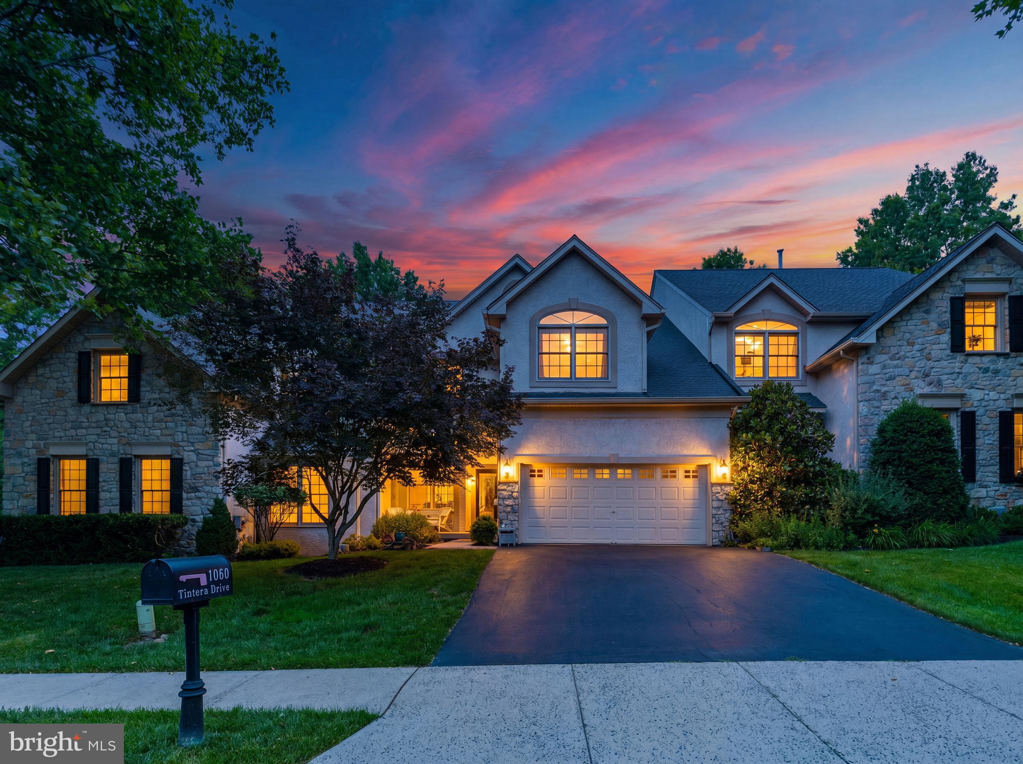 Nestled toward the rear of one of Lower Gwynedd Township's most desirable townhouse communities, this extensively renovated residence offers a rare combination of privacy, sophistication, and convenience. Backing to mature woodlands rather than neighboring homes, the setting provides a peaceful backdrop seldom found in attached living while remaining just moments from shopping, dining, major commuter routes, and all that makes Lower Gwynedd such a sought-after destination. Thoughtfully transformed over the past several years, the home showcases a cohesive design aesthetic highlighted by a cool, neutral palette, designer lighting, custom millwork, and quality finishes throughout. From the moment you step inside, it is evident that every improvement was made with intention, creating a home equally suited for everyday living and effortless entertaining. At the heart of the home is a beautifully renovated kitchen designed with the culinary enthusiast in mind. Featuring quality cabinetry, stone countertops, premium fixtures, a Sub-Zero refrigerator, Blanco Silgranit sink, and coveted Wolf range, the space blends form and function while serving as the centerpiece of the main level. The kitchen opens seamlessly to the dramatic vaulted family room, where a striking two-sided fireplace creates a warm focal point shared with an adjoining gathering area enhanced by custom bar cabinetry—ideal for entertaining, celebrating holidays, or simply unwinding at the end of the day. Sliding glass doors lead to an expansive rear deck overlooking the wooded backdrop. Whether enjoying morning coffee, hosting summer gatherings, or dining al fresco beneath the trees, this private outdoor retreat offers a peaceful setting rarely found within a townhouse community. Steps descend directly to the rear yard, creating a seamless connection between indoor and outdoor living. The second level is anchored by an impressive owner's retreat featuring vaulted ceilings, dual custom-organized walk-in closets, and a fully renovated spa-inspired bath. Thoughtfully appointed with separate vanities, premium fixtures, a custom glass shower enclosure, designer tile selections, and a private water closet, the space offers the comfort and feel of a luxury hotel suite. Overlooking the family room below, the light-filled loft provides exceptional flexibility as a home office, reading lounge, or secondary living space. Two additional generously sized bedrooms and an updated hall bath complete the upper level. The finished lower level adds approximately 800 square feet of additional living space and significantly enhances the home's versatility. Filled with natural light from a large egress window, this level offers ample room for recreation, fitness, gaming, media enjoyment, or play, while a convenient powder room, pantry area, and extensive finished storage provide everyday practicality. Beyond the impressive cosmetic renovations, the home offers the confidence of substantial mechanical updates, including newer HVAC systems, water heater, roof, and other major operating components. An oversized air-conditioning system provides exceptional comfort and efficiency, further reinforcing the home's truly move-in-ready appeal. Equally appealing is the property's functionality. A two-car garage, private driveway parking for two additional vehicles, and convenient guest parking directly across the street make hosting family and friends effortless. Adding to the home's appeal, a network of wooded walking trails meanders throughout the community, offering residents a unique connection to nature while providing convenient pedestrian access to nearby shopping, dining, and everyday amenities. Combining extensive renovations, thoughtfully curated finishes, updated mechanical systems, exceptional living space, and one of the community's most desirable locations, this turnkey residence presents a rare opportunity to enjoy low-maintenance living without compromise. Call for your showing TODAY