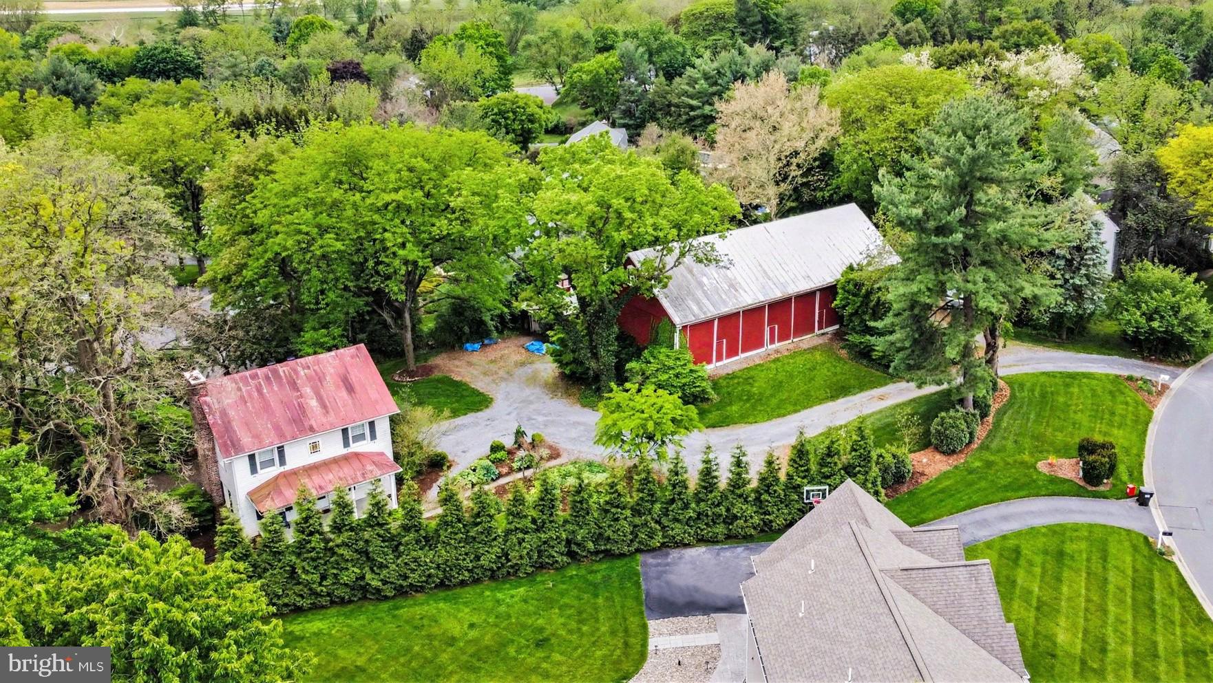 181 Windover Turn - a truly one-of-a-kind oasis, secluded in a idyllic suburban Manheim Township neighborhood. Upon entrance, you'll be struck by the grandeur of the 19th century, magnificently-preserved timber-frame barn, offering unlimited value & potential, from commercial to recreational to the limits of your imagination.  The lower level contains a 1-bedroom apartment (that will convey vacant) offering residual income, and a finished business office (all permitted) and storage area that offers further development potential.
The century-old 2.5 story farmhouse boasts modern amenities combined with country charm, with 3 floors of 2,100 sq ft of living area, 4 bedrooms, 2 full baths, office/flex area & 2 fireplaces ... all in a cozy, wooded environment. 
Imagine entertaining friends on the screened porch or picnic area w/fire ring, while the young'uns are playing nearby on the permanent playset with slide.  All this with the greatest of all assets ... location, location, location.  Don't wait to see it.