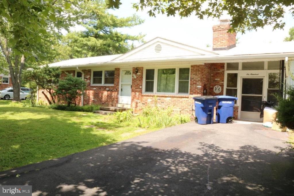 This quaint single family home  in the heart of downtown Herndon can be your new home!  Rarely available for rent, this cozy rambler with hardwood flooring on main level provides a great space to call home.   Living room boasts a wood burning fireplace. Separate dining room and spacious kitchen with ample storage. Large sunroom addition w/ access to the driveway. Main level features 2 bedrooms with 2 full baths. Walk out lower level with wood burning fireplace, tons of storage, laundry room, den/3rd bedroom and full bath. Kitchen counter will be replaced asap. Home will have walls and ceilings on upper level and stairway to basement  painted asap.