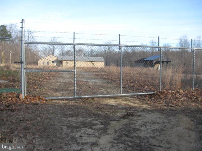 Prime Industrial Property with many opportunities available with direct access on Solomons Island Road MD 2/4.  2,400 SF retail/warehouse, 1,924 SF residence/workshop, 7,349 SF warehouse w/outbuildings and security gate.  In total 10+/- acres offered with this property.  Priced to sell! Price includes 4 parcels 1650, 1670, 1678, and 1680 Solomons Island Road.