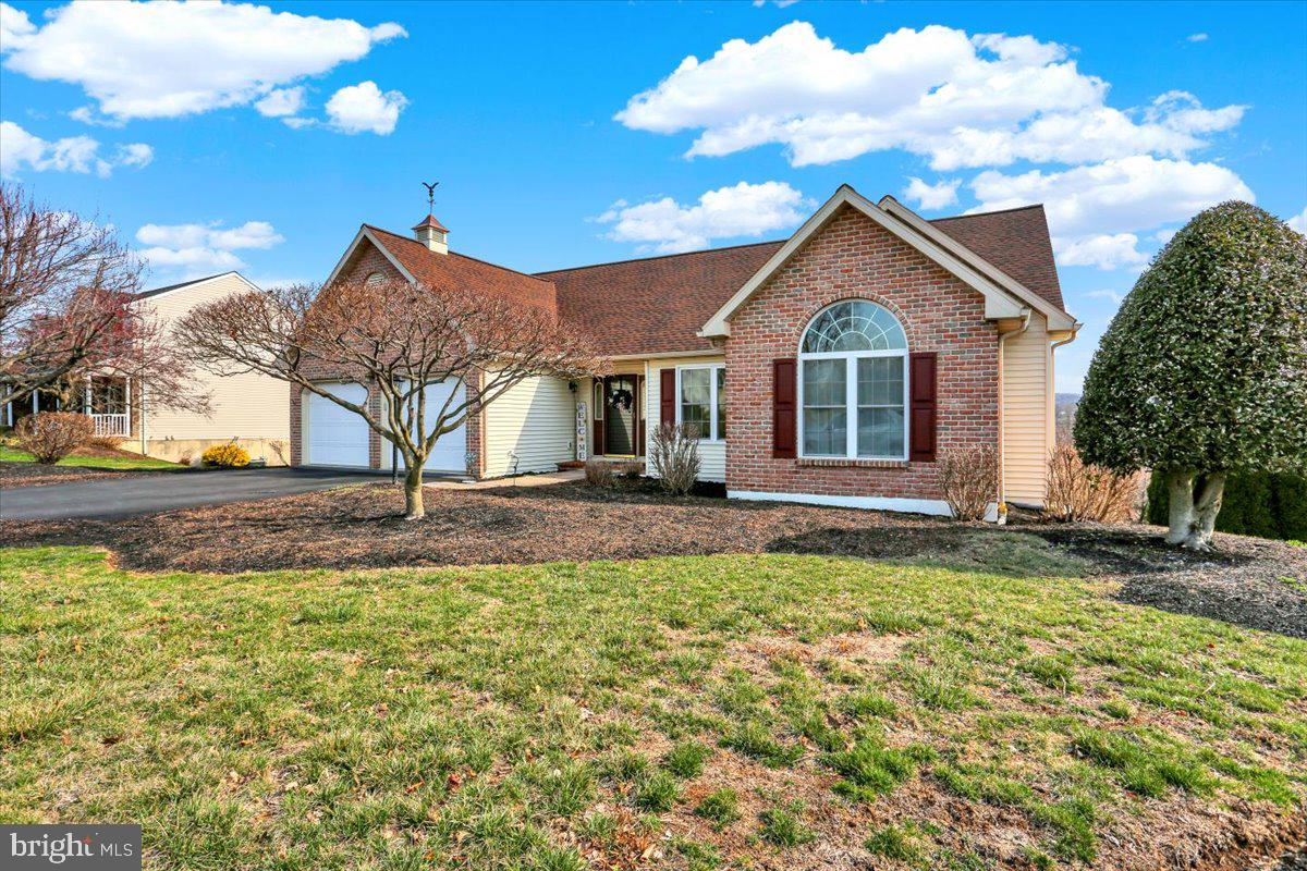 Beautiful 1-story home in Muhlenberg Township with attached 2 car Garage,  Great Room w/ cathedral ceilings, hardwood floors & gas Fireplace, Dining Room with hardwood floors, open eat in kitchen leads to deck with great views!  The Main Bedroom is spacious and offers a walk in closet, attached bath with soaker tub , walk in shower & linen closet;  2 additional Bedrooms and hall Bath on 1st floor.  Wonderful lower level Rec Room with Pool Table, Bar and PUTTING GREEEN!  Plus an additional 1 car garage in rear of home for storage, lawn equipment, etc.