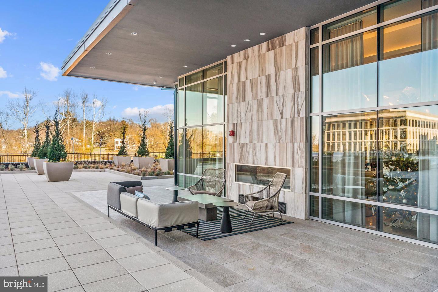 Experience elevated living in this rarely available corner penthouse at The Haven, National Harbor's award-winning luxury residence. Originally designed as the community's model home, this exceptional condominium showcases sophisticated style, premium finishes, and an abundance of natural light throughout its thoughtfully designed 1,341 square feet. Featuring three spacious bedrooms, each with a walk-in closet, and two beautifully appointed spa-inspired bathrooms, this residence offers both comfort and elegance. The open-concept floor plan seamlessly connects the living, dining, and kitchen areas, creating an ideal space for entertaining and everyday living. High ceilings, huge and bright windows, designer finishes, and top-of-the-line appliances further enhance the home's upscale appeal. Offered is the MODEL home with full array of builder-selected designer furnishings and décor, this barely lived in residence presents a truly turnkey opportunity. Step outside to your private balcony and enjoy the vibrant energy of National Harbor from your own retreat. One of the most exceptional features of this penthouse is the inclusion of three deeded parking spaces a rare and valuable offering. Whether reserved for guests or leased to fellow residents for additional income, these extra spaces provide unmatched flexibility and convenience.
Residents of The Haven enjoy an impressive collection of resort style amenities, including a sophisticated resident lounge, billiards room, theater space, co-working areas, fitness center, yoga studio, and even a self-service dog spa. Relax by the stunning two-sided linear fireplace in the lobby lounge or enjoy outdoor access to the pool and patio areas during the warmer months. The Haven holds the distinction of being the only residential building at National Harbor to receive recognition from both the Washington Business Journal and the National Association of Home Builders. Beyond the building itself, you'll enjoy one of the region's most vibrant waterfront destinations, with more than 160 restaurants, shops, entertainment venues, and attractions just steps from your door. The nearby MGM National Harbor offers world-class dining, entertainment, and gaming, while the Woodrow Wilson Bridge Trail and waterfront fitness classes provide endless opportunities for recreation. Corner penthouses at The Haven are exceptionally limited, and opportunities like this rarely become available. Add in three parking spaces and storage unit, designer furnishings, and this offering truly stands apart from the rest. Luxury, convenience, and an unmatched lifestyle await.