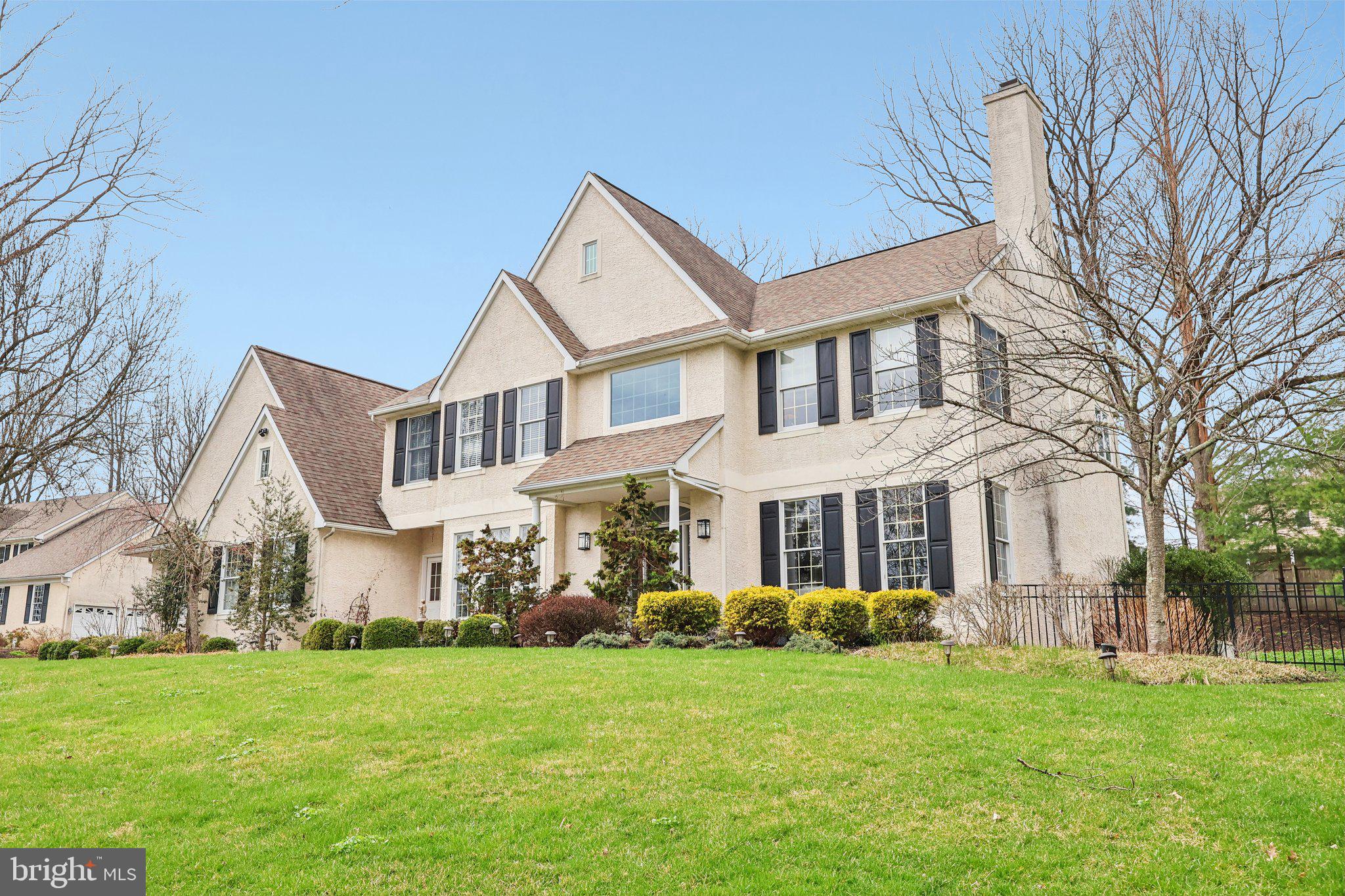 Welcome to 939 Kilduff Circle, a 5-bedroom, 4.5-bath single-family home located in West Chester. Situated on 1.25 acres with a large fenced-in yard, this home offers both space and privacy. As you approach the home, a finished three-car garage, with an electric charging port, offers convenience and ease. As you enter, you’re welcomed by a two-story foyer featuring hardwood floors and chair rail with wainscoting. Just off the foyer is a home office with carpet flooring, crown molding, chair rail with wainscoting, and a triple window with a built-in window seat. The living room features hardwood floors, crown molding, and a wood-burning fireplace with a slate surround, while the dining room offers hardwood flooring, chair rail with wainscoting, and a tray ceiling, perfect for entertaining. The kitchen is well-appointed with hardwood floors, granite countertops, an island with seating, a breakfast area, stainless steel appliances including a Wolf 6-burner gas cooktop, a pot filler, an oven with a warming drawer, pantry, wine refrigerator, and a door leading to the patio. The outdoor space is ideal for entertaining, featuring a beautiful stone patio with a built-in grill and a fully fenced yard. The great room offers hardwood floors, a vaulted ceiling, and a wood-burning fireplace, creating a comfortable gathering space. A mudroom with tile flooring, a separate entrance, and a powder room complete the main level. Upstairs, the spacious primary suite features carpet flooring and a vaulted ceiling. The en-suite bathroom includes tile floors, a vaulted ceiling with skylight, a double sink vanity with a make-up area, a jetted tub, a walk-in shower, and a walk-in closet. Two additional bedrooms on this level feature carpet flooring and share a full hall bathroom with tile floors, a tub/shower with glass door, and a double sink vanity. A fourth bedroom includes its own en-suite bathroom with tile floors and a walk-in shower. The fifth bedroom features engineered hardwood flooring, a ceiling fan, and a window seat. The finished lower level expands the living space with a family room and rec room—ideal for a playroom, home gym, or media space—along with a large laundry room, a full bathroom with tile floors and a tub/shower combination, and a bonus room offering additional flexibility. This home is further enhanced by a Generac generator, a whole-home water filtration system, and a security alarm system, offering convenience, reliability, and peace of mind.Conveniently located near local shopping, grocery stores, restaurants, and more, this home is also just a short drive to downtown West Chester. Don’t miss the opportunity to make 939 Kilduff Circle your new home.
