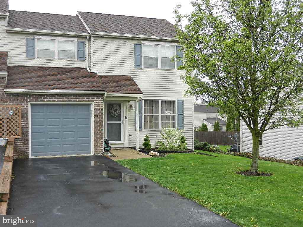 Home has 24x11 addition on the rear leading to deck & nice yard.  Updated KIT w/ cabinets added & updated counter tops.  Huge MSTR suite w/ walk-in closet.  Attached GAR round out this end-unit.  BA w/ tub & separate shower.