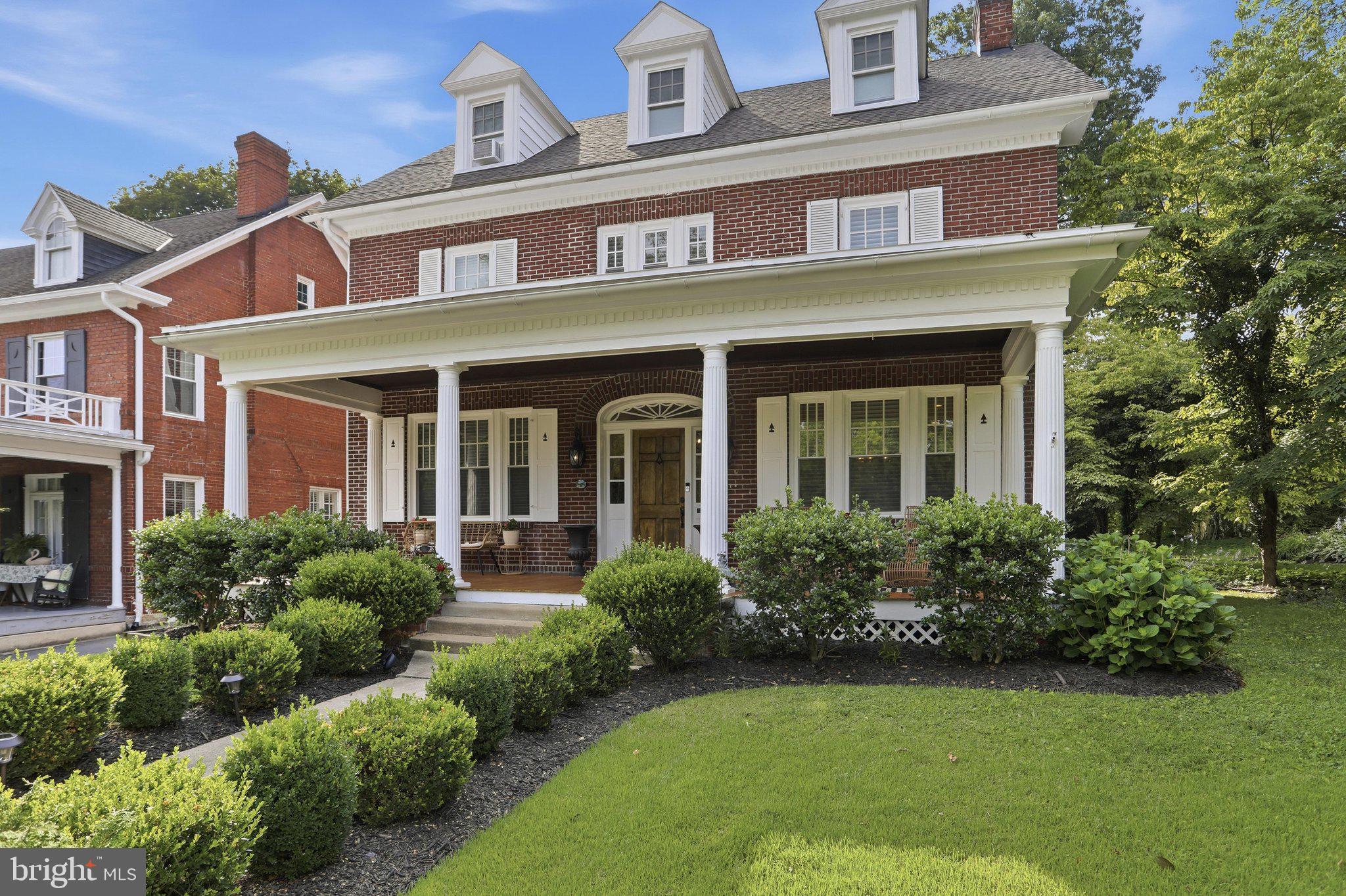 Welcome to 1018 The Terrace, a beautifully restored 1925 Colonial Revival nestled on one of Hagerstown's most picturesque, tree-lined streets in the highly sought-after North End. Offering 5 bedrooms, 4 full bathrooms, and 2,957 square feet of beautifully finished living space, this exceptional residence seamlessly blends timeless architectural character with the comfort and convenience of modern living.

From the moment you arrive, the home's stately curb appeal and inviting front porch make a lasting first impression. Inside, rich refinished original hardwood floors, beautifully restored solid wood doors, and exquisite original wood trim showcase the craftsmanship of a bygone era while complementing thoughtfully updated finishes throughout.

In 2018, the home underwent an extensive top-to-bottom renovation, carefully preserving its historic charm while rebuilding the home for today's lifestyle. Major systems—including the electrical, plumbing, HVAC, kitchen, bathrooms, and interior finishes—were comprehensively updated, allowing you to enjoy the beauty of a historic home with the confidence and convenience of modern construction. A new roof was installed in 2023, further enhancing the home's long-term value.

Designed for both everyday living and entertaining, the spacious floor plan offers generous living areas filled with natural light and timeless character. Five generously sized bedrooms and four full bathrooms provide exceptional flexibility for growing families, guests, home offices, or multigenerational living.

The outdoor living space is equally impressive. Step onto the expansive covered rear porch overlooking professionally landscaped grounds, mature shade trees, a stunning flagstone patio, and a fully fenced backyard creating a private setting that's perfect for entertaining, relaxing with family, or enjoying quiet evenings outdoors.

Additional features include a detached garage, abundant basement storage with future finishing potential, and an unbeatable location just minutes from schools, parks, shopping, dining, and commuter routes.

Beautifully restored, meticulously maintained, and thoughtfully modernized, 1018 The Terrace offers a rare opportunity to own one of Hagerstown's premier historic homes where timeless craftsmanship, modern comfort, and exceptional outdoor living come together in one unforgettable property.