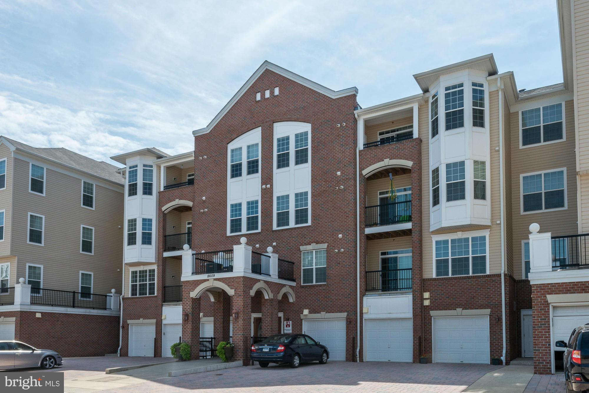 5-year new 55+gated community with all the amenities you could want & more: community center w/fitness, walking trails, swimming pool, garage & elevator.  Stunning freshly painted & newly carpeted top-floor unit offers granite/SS kitchen, 9" ceilings, master BR w/tray ceiling & sitting area, walk-in closets, roomy storage, front-load waster/dryer and bright balcony to catch the breezes.
