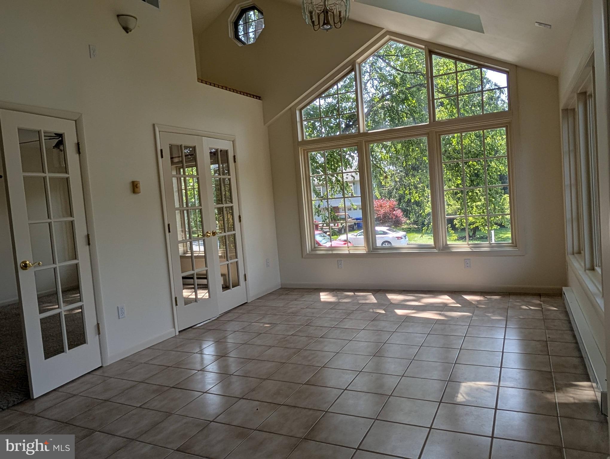 Freshly painted generous size spilt-foyer featuring over 2600 sq ft of grande finished living space boasting unique contemporary floor plan w/master bedroom and half bath addition with your own unique interior hot tub completed in 2002. The 1976 1st floor finished space offers multiple options as possible bedroom/den an appealing work from home space. The 2-double French door openings lead to tiled sunroom w/ cathedral ceiling, skylights and sink. The cherry kitchen cabinets in like-new condition with new laminate flooring off traditional living room with huge bow window and dining area to 30 ft rear deck overlooking tree-shaded back yard with oversized 2-level shed. Lowel- level carpeted family room features wood-burning brick FP w/ extra 2 carpeted bedrooms, one with full-bath, ideal for in-law  or guest  quarters.  Home features central vac and rear workshop with heat and 220 electric will appeal to the hobbyist.