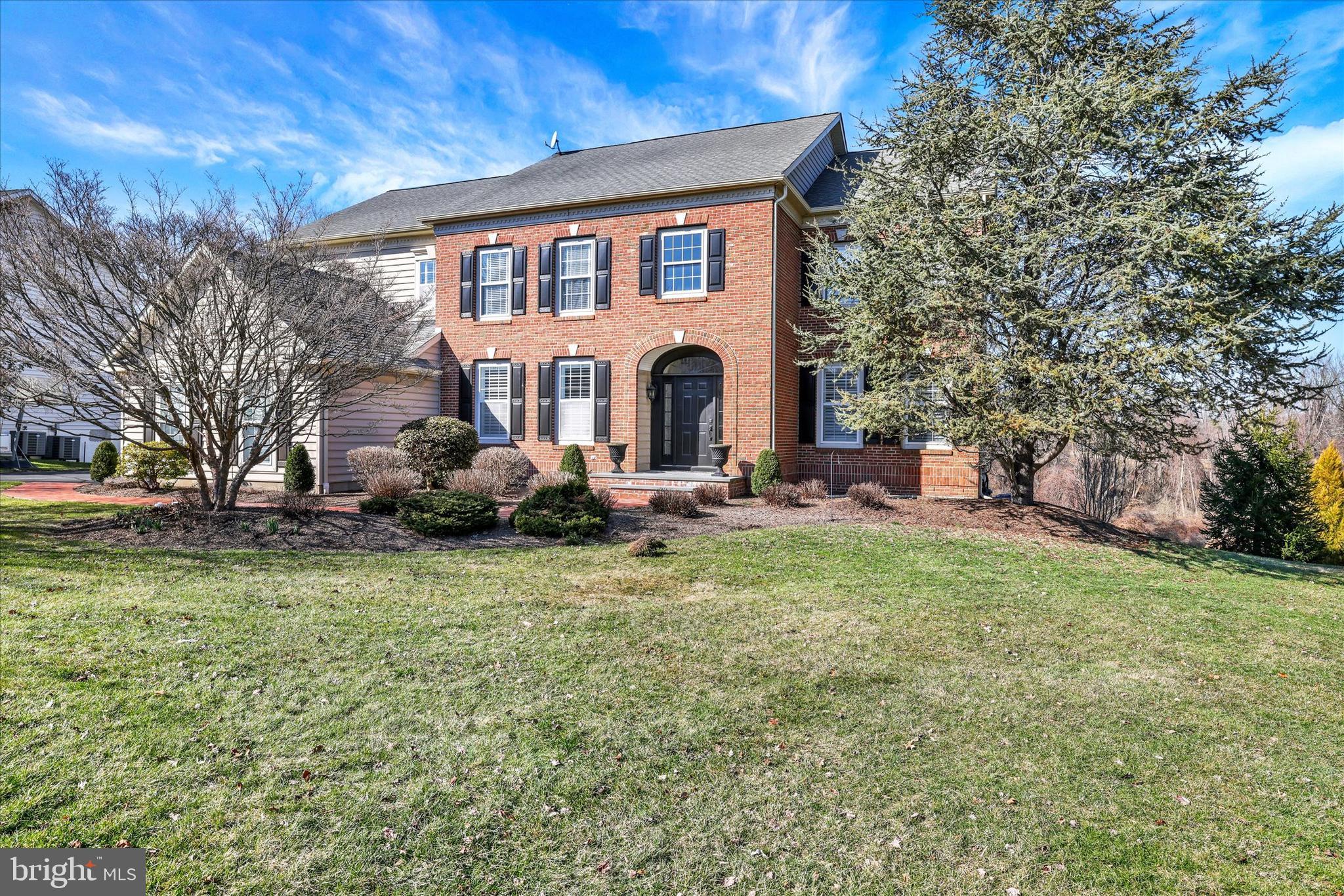 Welcome to 1283 Clearwater Drive, located in the highly sought-after community of Clearview Estates in Yardley, PA. This elegant 5-bedroom, 3.5-bath “Windsor” model features a classic brick façade, an oversized three-car side-entry garage, and a ver private back yard with open and wooded views.  A curved brick walkway leads to the inviting covered bluestone front porch, creating a warm and sophisticated entrance. The impressive two-story foyer welcomes you with ceramic tile flooring, upgraded moldings, and a turned oak staircase with a custom runner. Double glass doors open to a private office featuring hardwood flooring, crown and dentil moldings, recessed lighting, and custom plantation shutters. The adjacent living room includes a dry bar, newly installed engineered hardwood flooring (3/12/2026), recessed lighting, crown and dentil moldings, and plantation shutters, creating a refined space for entertaining. The formal dining room showcases crown, chair, and dentil molding along with a large bay window offering scenic views. The chef’s kitchen is beautifully appointed with upgraded cherry cabinetry with under-cabinet lighting, granite countertops, a double undermount stainless steel sink, and a subway tile backsplash. Stainless steel appliances include a KitchenAid five-burner cooktop, Frigidaire double-wall ovens, dishwasher, Gallery French-door refrigerator, and GE microwave. The center island with seating offers additional cabinetry, granite countertops, and two custom pendant lights. The adjoining breakfast room, with a garden bump-out, provides access through a glass door to the expansive maintenance-free Trex deck (2016) overlooking peaceful, private views. The sun-filled two-story family room features a dramatic wall of windows, random plank engineered hardwood flooring, and a stunning floor-to-ceiling stone gas fireplace with custom millwork. A main-level laundry room and powder room complete the first floor. Upstairs, the hallway features random plank hardwood flooring, a linen closet, and a loft area. Double doors lead to the luxurious owner’s suite, highlighted by a vaulted ceiling, two spacious walk-in closets, and an expansive sitting area currently used as a second office. The recently renovated owner’s bath (2023) offers a double walk-in shower with a seamless farmhouse sliding glass door, American Standard freestanding oval tub, dual vanities, and a private water closet. Three additional well-appointed bedrooms and a full hall bathroom with tub/shower complete the upper level. The refinished daylight walk-out basement (2019) provides exceptional additional living space, including a large recreation/media room with luxury vinyl plank flooring and French doors leading to a spectacular EP Henry patio with custom retaining wall and built-in fire pit (2020). A spacious game room enhances the entertainment area. The conditioned wine storage room with custom racks offers ample storage for wine enthusiasts. A pocket door leads to the fifth bedroom, complete with a private sitting area, along with a full bathroom featuring a large walk-in shower and ceramic tile flooring.
An additional 460 square feet of storage and mechanical utility space completes the lower level. Additional highlights include a newer dual-zone A/C  system (2021) and an EP Henry walkway connecting the driveway to the rear patio and deck areas, along with many other thoughtful upgrades throughout this exceptional home. For outdoor and fitness enthusiasts, Makefield Highlands Golf Club is just steps away, while the scenic Delaware Canal towpath, less than two-tenths of a mile from the community, is easily accessed via a safety path. Tyler State Park is also just five miles away, offering miles of trails and natural beauty. Clearview Estates is minutes from the charming boroughs of Yardley & Newtown. Convenient commuter routes provide easy access to Philadelphia, Princeton, and New York City. This exceptional home is impeccably maintained!