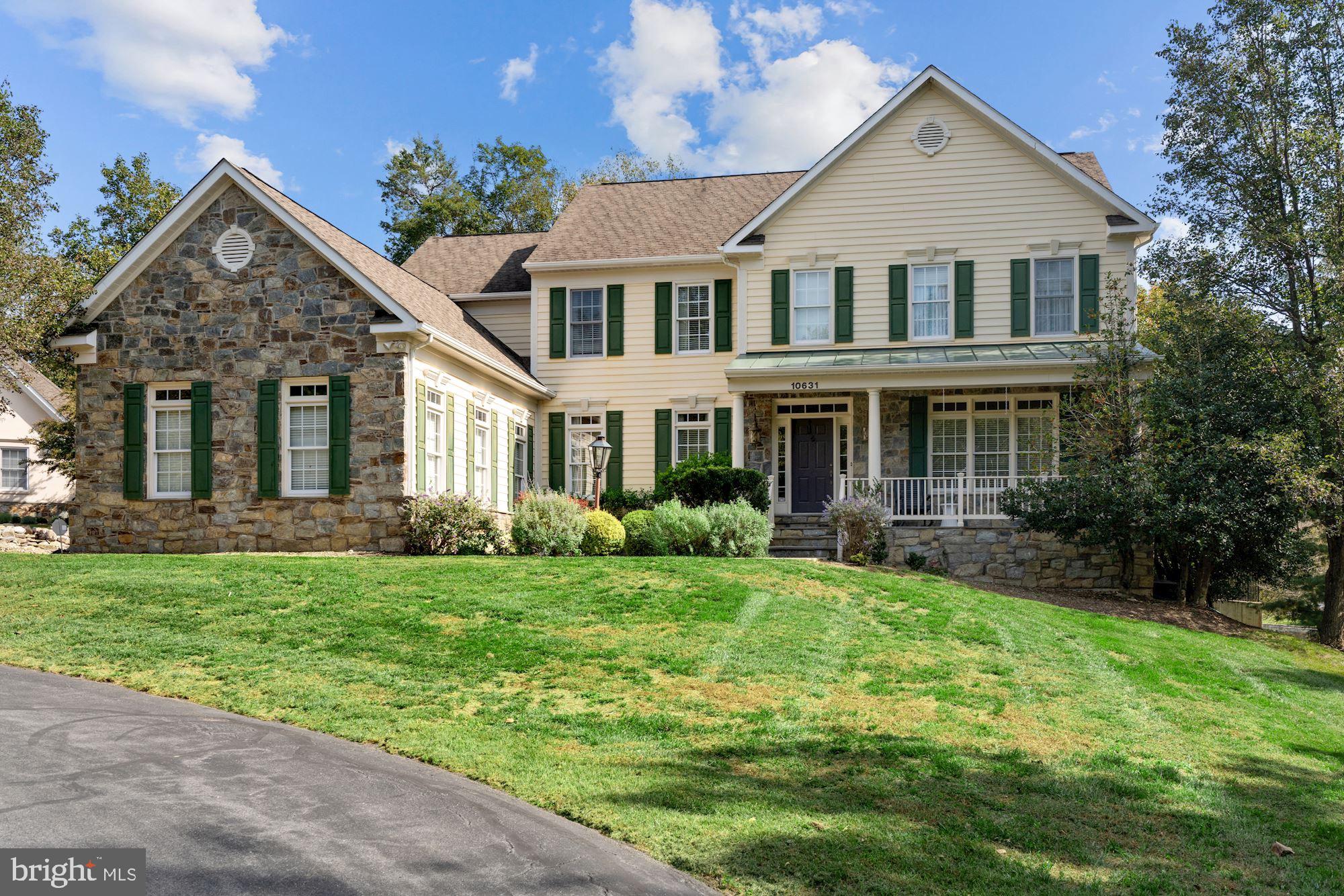 Tucked off to the right in a set back cul-de-sac is 10631 MacArthur Boulevard, a fantastic modern colonial home perfectly situated in Potomac, Maryland. Built by Potomac Heritage Homes, this generously sized home hosts five bedrooms, four full bathrooms and two powder rooms over three finished levels. This home has that extra inviting curb appeal with stone, siding, shutters and that front porch everyone wants. Just steps away from the C&O canal, offering access to multiple trails, this home is a rare find in such a unique location. 

Perfectly wrapped with a stone and slate covered front porch, enjoy the view of the manicured front yard. The main entrance showcases a tray ceiling, paneled columns, and hardwood flooring. The living room is complete with a gas fireplace and offers bright and sunny views from the front of the house. The dining area highlights chair rail molding, a glamorous chandelier, designer wallpaper and conveniently connects to the wet bar where a beverage cooler and ample cabinet space can be found. The gourmet kitchen has everything you could possibly need for daily living and entertaining. Perfectly covered in oversized tile flooring, this kitchen is complete with side-by-side refrigerators, double ovens, stainless steel appliances, and a six-burner Viking Professional gas range stove. This kitchen lacks no design detail showcasing custom tile backsplash, granite countertops and island lighting. The center island offers bar seating, while the beautiful bay window encloses the large kitchen table space, capturing the backyard views through the sliding-glass doors that conveniently connect to the back deck. Step down into the family room, which is the ideal space to lounge and gather with the gas fireplace and spacious seating area covered in newly carpeted floors. The sunroom offers vaulted ceilings with fans, new flooring, deck access, and is perfectly wrapped in windows offering wooded backyard views. Working from home is incredibly convenient with the high design office space that features custom built cabinetry, a modern light fixture and windows wrapped in designer shades. Two powder rooms can be found on this level, one decked in designer wall paper and the other located in the mudroom which showcases generous cabinet and countertop space, built-in shelves, a front-loading washer and dryer, and a convenient side entrance. Additional closet and pantry space can be found in the hall that also provides access to the three-car garage.

The newly carpeted stairs will lead you to the upper level where four bedrooms and three full bathrooms can be found. The spacious primary bedroom highlights a tray ceiling in both the bedroom and sitting area. Take in the wooded backyard views in the sitting room, which is ideal for lounging. The luxurious en-suite bathroom has everything you could dream of from heated floors, dual vanities with custom cabinetry and granite countertops, an over-sized custom tile walk-in shower, free-standing tub, mounted TV and access to the custom walk-in closet. No detail was left behind with this high-design closet that offers built-in shelving and custom drawers. One additional bedroom offers track lighting, an ensuite bathroom and walk-in closet, while the two remaining bedrooms feature custom light fixtures, a jack-and-jill bathroom and generous closet space.

The lower level of this house is not to be missed with a media room, recreation area, full bedroom and bathroom, and endless storage space. The open recreation area offers a walkout to the yard and connects to the media room complete with built-in speakers. The additional bedroom connects to a full bathroom and two large storage areas can be found in the back of this level, allowing you to tuck away any larger items or use as additional recreation space.

Enjoy the convenience of being minutes away from the Potomac Village, River Falls Swim & Tennis and steps away from the endless trails that Great Falls has to offer!