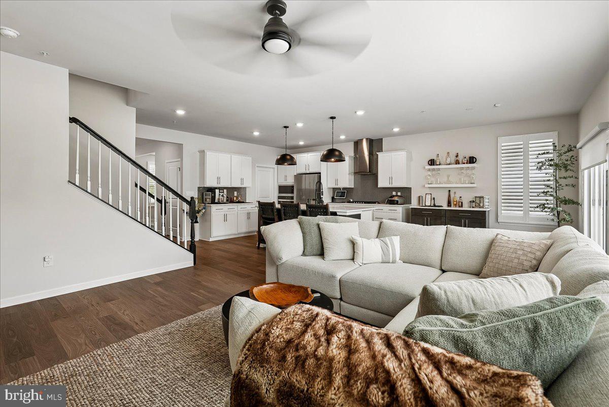 Over $90,000 in upgrades are already done — no waiting, no change orders, no builder markups. Inside: plantation shutters throughout, three custom-built closets, a butler's-pantry extension, a kitchen bar, and a fully outfitted laundry room. The home lives smart, with Nest cameras covering the front door, garage, driveway, and patio, plus in-wall and in-ceiling surround sound and upgraded lighting and ceiling fans in every room. A whole-home dehumidifier and radon mitigation system build in comfort and peace of mind. Outside, a professionally landscaped, fully irrigated yard, an enhanced patio with motorized power shades, and an epoxy-finished garage complete the package. This is what new construction looks like after $90K and a year of thoughtful finishing — available now, at roughly $193 per square foot.