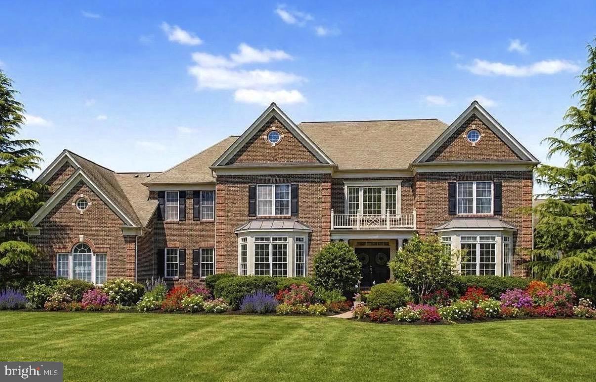 Surrounded by sweeping grounds, arboretum landscaping, and tranquil pond views, this magnificent 5,880 sq ft property offers a rare opportunity to embrace an elevated outdoor lifestyle within the esteemed New Hope Solebury School District. Positioned on a prime 2.5+ acre corner lot, the stately brick residence is surrounded by expansive lawns, peaceful natural scenery, and endless space for outdoor dining, entertaining, recreation, or simply enjoying the serenity of the landscape. From morning coffee overlooking the water to evenings spent gathered around the outdoor fireplace, every aspect of the property is designed to celebrate the beauty of its setting. A spacious terrace and balcony extending from the conservatory overlooks the backyard and pond, creating a stunning vantage point for relaxing or hosting guests. Custom built by Pulte Homes and impeccably preserved by its original owners, the residence warmly welcomes with an elegant foyer and a sweeping curved staircase. Inside, you'll be greeted by cherry hardwood floors, intricate crown molding, and spaciously arranged living areas ideally suited for both daily living and entertaining. The 2-story great room serves as a dramatic centerpiece, boasting towering coffered ceilings and a wood-burning fireplace, all beautifully showcased by vast windows presenting idyllic property views. Nearby, a sun-drenched conservatory hosts a custom bar with timeless black granite countertops and seamlessly leads into a private office. The gourmet kitchen is extremely functional and spacious, equipped with gas cooking, an oversized center island, double ovens, a bonus eat-in breakfast nook, a walk-in pantry, stunning glass upper cabinetry, and direct access to the back patio, facilitating effortless indoor-outdoor occasions. A swinging door leads you into the dedicated dining room, perfect for hosting and holiday dinners.

Upstairs, four generous ensuite bedrooms ensure comfort and privacy. The massive primary suite is complete with a sitting room, walk-in closet, and a luxurious, one-of-a-kind bath with Travertine tile floors, dual vanities, a glass-enclosed shower, and a jacuzzi soaking tub. Head down to the fully finished English basement to find even more versatile space for recreation or relaxation. Outside, the property offers an unrivaled canvas for alfresco living. Expansive patios serve as versatile hubs for dining and socializing, while a custom-built outdoor fireplace creates a warm and inviting atmosphere for year-round enjoyment. The grounds strike a perfect balance between recreational open lawns and tranquil pond-side retreats. To the right of the home, the side lawn presents boundless potential for a future tennis court, additional gardens, or any other custom feature your heart may desire. Additional highlights include three-zone HVAC, upgraded systems, a security system, and an oversized three-bay garage with additional storage. Perfectly situated in the heart of Solebury Township, just moments from Peddler’s Village and the charming river towns of New Hope and Lambertville, enjoy convenient access to New York City, Philadelphia, shopping, dining, and major commuter routes. Expertly blending privacy, scale, outdoor living, and sophistication, this exceptional property is now being offered to the market for the very first time — 104 Meadowview  awaits your arrival.