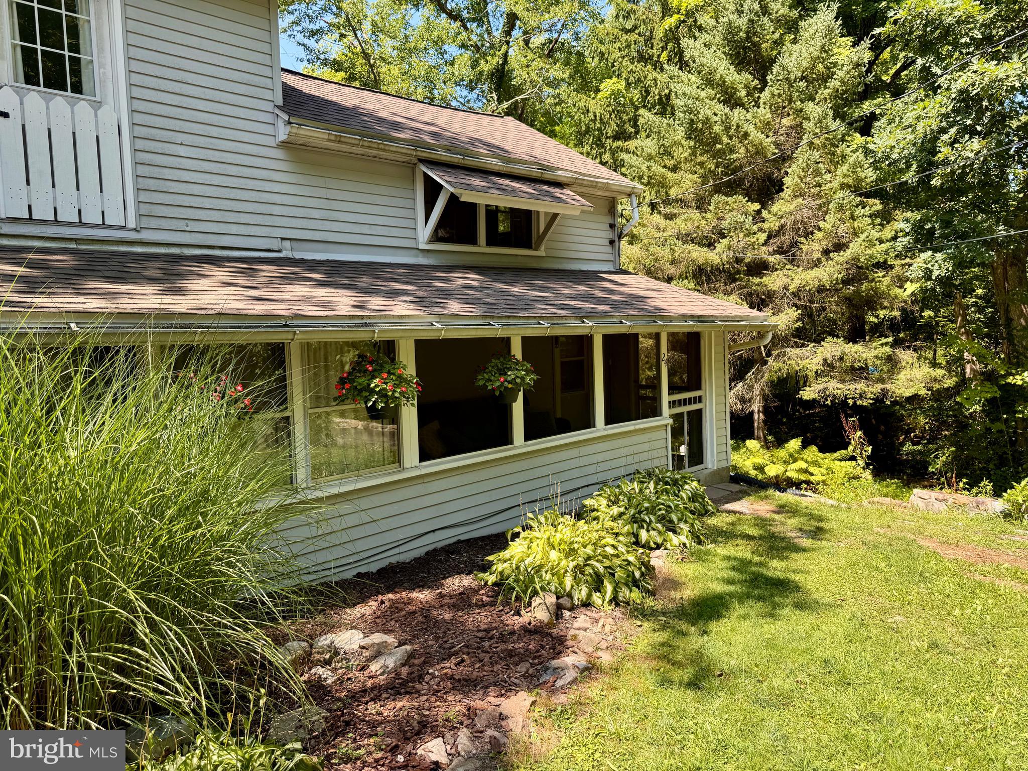 **Calling all nature lovers—this one is for you!**

Escape to the peaceful charm of the Lake Strause Community, where mature trees, babbling brooks, and abundant wildlife create the perfect natural retreat.  Nestled in this serene setting, you’ll find a cozy cottage that is ideal as a weekend getaway, seasonal cabin, or year-round home.

Step outside onto the brand-new deck overlooking a tranquil yard where deer and turkey frequently wander and, as the seller has experienced, may even choose to welcome their fawns.  Cozy up with a good book in the screened-in porch while enjoying the peaceful sounds of nature.

Inside, the home features a spacious enclosed porch filled with natural light, comfortable living areas, an updated bathroom, new bedroom carpeting, and a functional layout with plenty of opportunities to make the space your own. The second-floor bedroom and loft provide flexible sleeping accommodations.

A storage shed offers convenient space for lake gear, tools, and outdoor equipment.

Whether you’re searching for a peaceful escape or a place to call home year-round, tranquility awaits you at  24 Aster Lane!