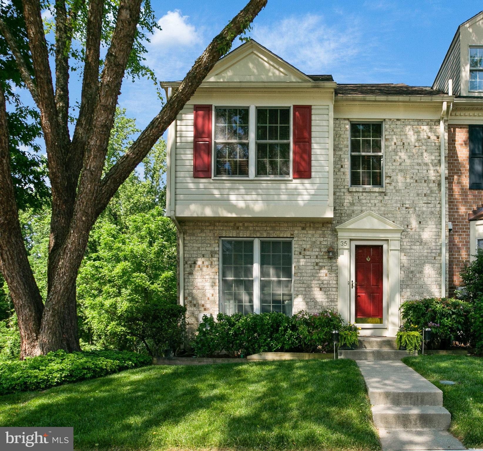 Amazing move-in ready 3 Level end unit Townhome in prime location that backs to woods in Garrison Woods off McDonogh Road. Hardwood floors throughout the first floor.  First level consists of a sunken living room, formal dining room, powder room and updated kitchen with breakfast room w/access to deck.    First floor rooms have chair rail and crown molding.  Second story consists of the primary bedroom and two more bedrooms.  Primary bedroom has vaulted ceiling and generous bathroom tastefully remodeled with marble tile and  granite vanity counter top.   Hall bathroom is also generous and has mosaic marble tiled floor, marble tiled walls and granite vanity counter top.  Large Family room in the basement has a wood burning fireplace (hidden behind desk in photos), wet bar and access to covered patio.  Basement also has a storage/mechanical room with a washer and  dryer.   Cinch Home Warranty provided by owner.