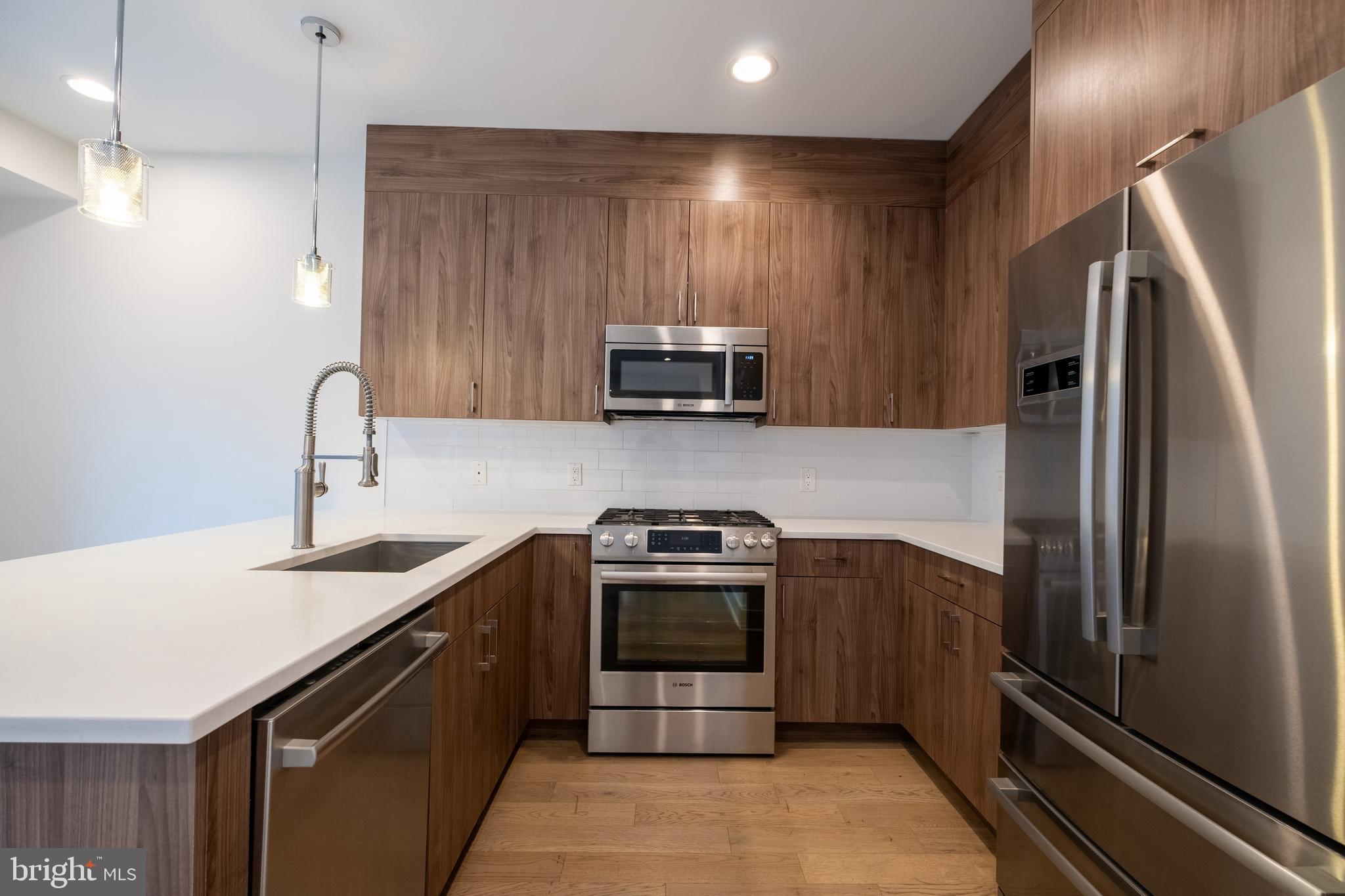 Luxury Living Meets Urban Convenience in the Heart of Northern Liberties
Welcome to The Quarters at Fairmount, an exclusive community of 38 architecturally distinct townhomes nestled in Philadelphia’s vibrant NORTHERN LIBERTIES NEIGHBORHOOD. This stunning 3-bedroom, 2.5-bathroom CORNER TOWNHOME offers the perfect blend of modern luxury, comfort, and convenience, set within a peaceful, landscaped courtyard that provides a true urban retreat.
Step inside to discover a thoughtfully designed OPEN-CONCEPT living space, where NATURAL LIGHT POURS IN through OVERSIZED WINDOWS with sunny southern exposure. The bright and spacious living room flows seamlessly into the formal dining area and an entertainer’s dream kitchen. Outfitted with SLEEK WHITE MARBLE COUNTERTOPS, CUSTOM CABINETRY, A BREAKFAST BAR, and top-of-the-line STAINLESS STEEL APPLIANCES, the chef’s kitchen is as functional as it is stunning. Upstairs, two generously sized bedrooms offer ample closet space, large windows, and a shared spa-inspired bathroom featuring elegant marble and tile finishes. The top level is dedicated to a LUXURIOUS PRIMARY SUITE, your personal sanctuary with a private balcony, a large walk-in closet, a designer en-suite bathroom boasting DOUBLE VANITIES and a GLASS-ENCLOSED SHOWER with a window—an ideal combination of comfort and sophistication. At the top, a sprawling ROOFTOP DECK extends your living space for six months of the year, perfect for entertaining or unwinding with stunning city views.
With HARDWOOD FLOORS throughout, HIGH CEILINGS, and UPSCALE FINISHES, this home delivers exceptional value and timeless style. Residents of The Quarters at Fairmount enjoy BEAUTIFULLY MANICURED COMMUNITY GARDENS, serene shared green spaces, and the convenience of city living just steps from your door.
Live just minutes from Standard Tap, Café La Maude, Liberty Lands Park, Jefferson Pennsylvania Hospital, and Cooper Hospital. You’re also close to public transportation, major shopping centers, and some of Philadelphia’s finest dining destinations.
Whether you're hosting guests, spending quiet evenings at home, or exploring the vibrant neighborhood around you, this residence offers the ideal setting. Don’t miss this rare opportunity to own a contemporary townhome in one of Philadelphia’s most sought-after communities. Welcome home to Northern Liberties.