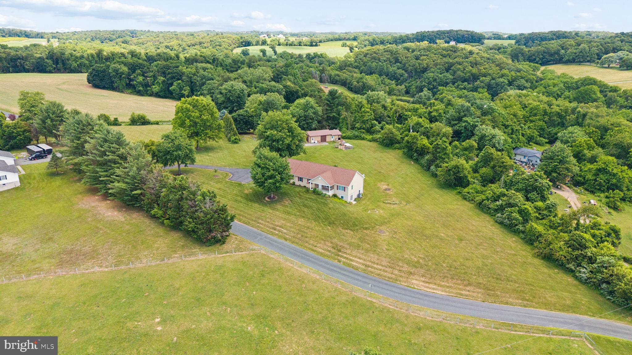 Welcome to your own little slice of country paradise at 5369 Long Corner Road! Situated on 3.71 picturesque acres and surrounded by breathtaking farm views in every direction, this charming 3-bedroom, 2.5-bath rancher offers the perfect blend of modern convenience and peaceful rural living.

Built in 2021 with thoughtful design throughout, this home embraces easy one-level living. The open-concept main living space is ideal for everyday life and entertaining alike, featuring a beautifully appointed kitchen with a large center island, abundant workspace, and a spacious walk-in pantry. The conveniently located main-floor laundry room makes daily routines effortless.

The private primary suite offers a generous walk-in closet and an en suite bathroom, while two additional bedrooms & full bathroom perfectly round out the upstairs living space . Need more room? The expansive walkout basement features tall ceilings and a rough-in for a full bathroom, providing the opportunity to nearly double your finished living space. The heat pump with propane back up offers efficient heating for the cold winter months!

Outside, the property truly shines. The oversized attached garage easily accommodates full-size pickup trucks, and the versatile pole barn spans 48x24ft and is ready for your hobbies and homestead dreams, featuring equipment storage on one side (24x32) and stalls for small livestock on the other (16x24). A charming chicken coop and ample room for gardens make it easy to embrace a self-sufficient country lifestyle.

Whether you're enjoying your morning coffee on the welcoming front porch or taking in a sunset from the back deck, the stunning 360-degree countryside views will leave you in awe. If you've been dreaming of a newer home with acreage, space for animals, and the tranquility of country life, 5369 Long Corner Road delivers everything you've been searching for.