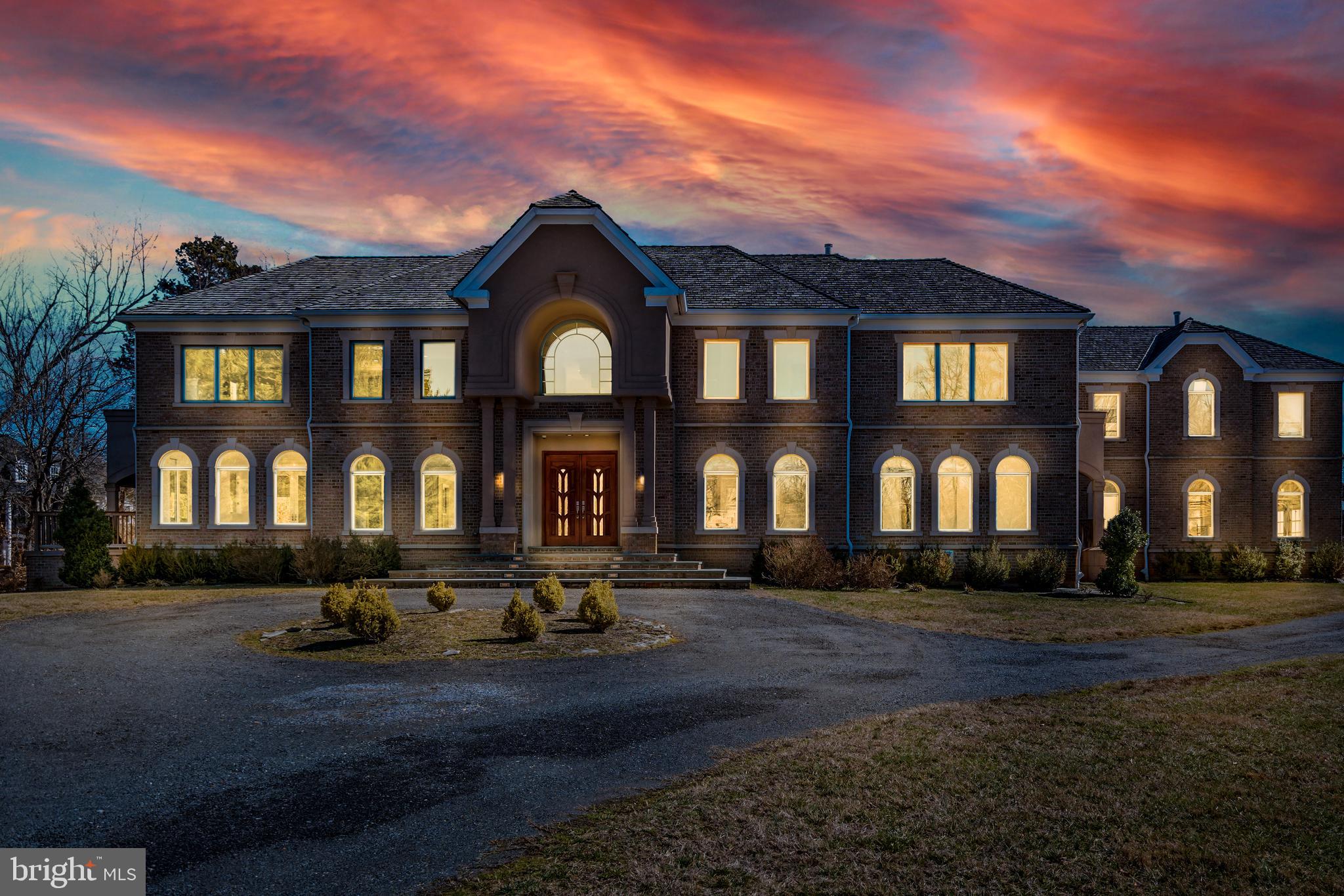 Stunning Luxury Custom Home in Gated Golf-Course Community of Woodmore situated on nearly 3 acres! Breathtaking unique masterpiece luxury home comes crafted with all amenities and appointments that you can imagine. This Palatial Estate home features 6 bedrooms 9 bathrooms with over  11,000 sq ft of living space. Separate In-Law Suite Set-up  with private entrance , complete with a second kitchen, climate control and spacious living area. Grand Foyer Entrance features Greece Rainfall Marble Floors with Imperial Staircase.  First floor features Cathedral Ceilings, Custom Crown Molding, Mahogany Wood Floors, Titon Box Beam Ceiling, Recess Lighting, Rear Spiral Stairs. Kitchen features Quartz Counters, Gourmet Pantry , Farmhouse Sink ,  Recess lighting and Cascading Fireplace offering a delicate striking balance of Living and Entertainment.  Home also boast a Master Suite with Mahogany Wood Floors,  Designer Closet, Wet Bar, Exclusive Laundry equipped with Washer/Dryer, Master Bath comes with his and her custom  tiled shower, signature freestanding tub, LED oversized vanity mirrors. Basement features, Theatre Room, Wine Showcase Room, Wet Bar, Full Kitchen , Family Laundry Station, Master Suite with FullBath and Fireplace, Recess Lights and Tile Floors. Additional features include Geo Thermal System, Elevator,  Circular Driveway, Olympic Pool, Multiple Decks, 3 Car Garage. Woodmore, host to World-class amenities including a golf course + country club with dining, pool, tennis and fitness facilities, don't miss this rare opportunity to own in Most Prestigious Established Community in Prince George's County.