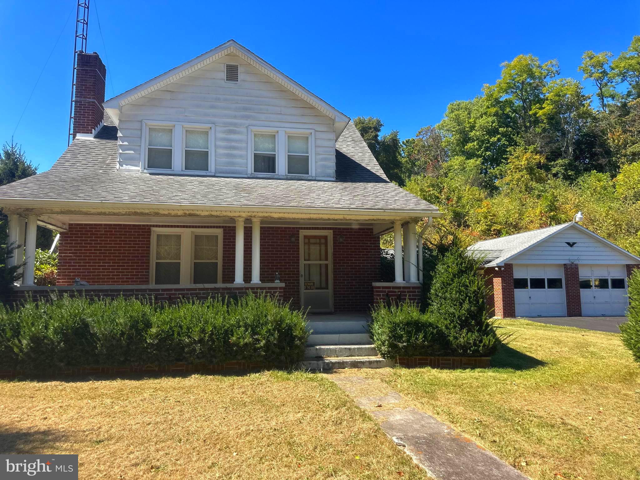 Enjoy the best of country living with this well-maintained brick home nestled in the peaceful community of Paw Paw, WV. This inviting property offers 3 bedrooms, 1 full bath, a comfortable living room, dining area with a reading nook, and kitchen with marble accents, along with a full unfinished basement providing plenty of storage or future potential.

Outside, you’ll find a two-car garage, carport, and ample driveway parking. The 4.6-acre property was once used for animals and features two barns and a pond—perfect for hobby farming, outdoor activities, or simply enjoying wide-open space.

Relax on the covered front porch in the evenings or take advantage of the spacious yard for recreation and gatherings. The roof is approximately 10–15 years old, and beautiful hardwood floors are hidden beneath the carpet throughout the home. Pine trees line the road frontage on both sides for privacy. 

This property offers a rare opportunity for quiet country living with room to grow.