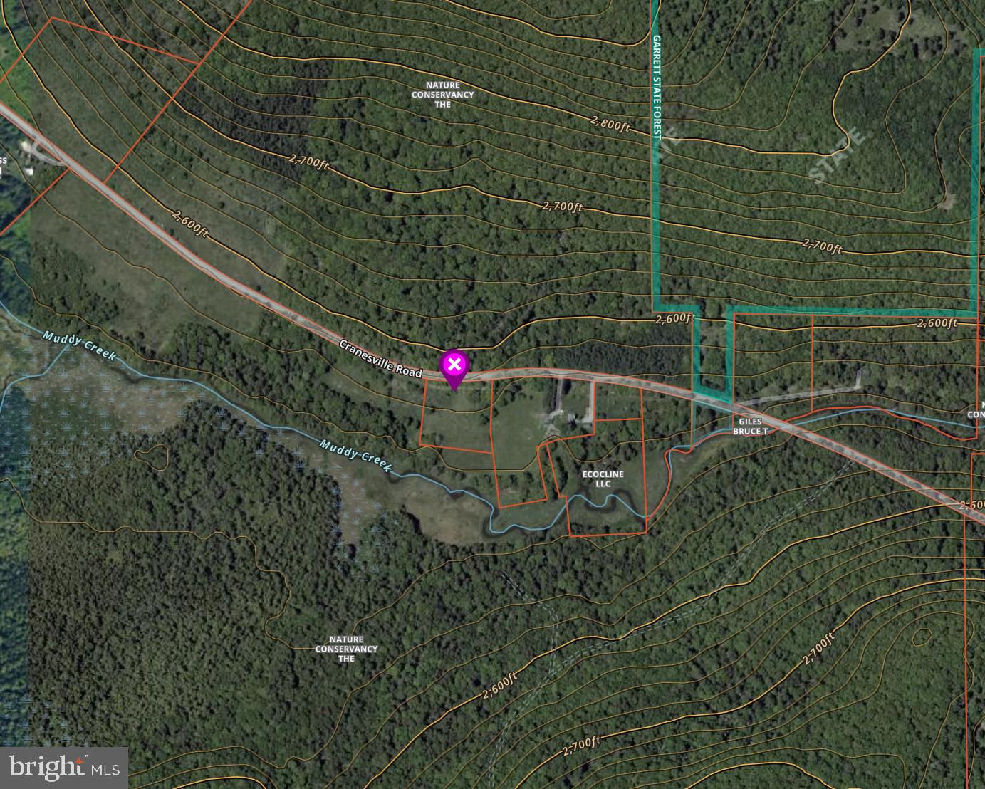 Discover one of Garrett County's most unique homesites, where Muddy Creek flows along the rear of the property and protected Nature Conservancy land creates an unmatched sense of privacy. Ideally situated near  Swallow Falls State Park, Herrington Manor State Park, Piney Mountain, and Garrett State Forest, this property offers access to some of Maryland's finest hiking, fishing, mountain biking, and outdoor recreation. The gently sloping lot features a beautiful mix of mature hardwoods, open lawn, and mountain views with southern exposure—an exceptional setting for your future mountain retreat. Survey completed, approved for a 4-bedroom home, and the driveway is already installed, allowing you to begin building sooner. A truly rare opportunity to own a private homesite surrounded by thousands of acres of protected natural beauty.