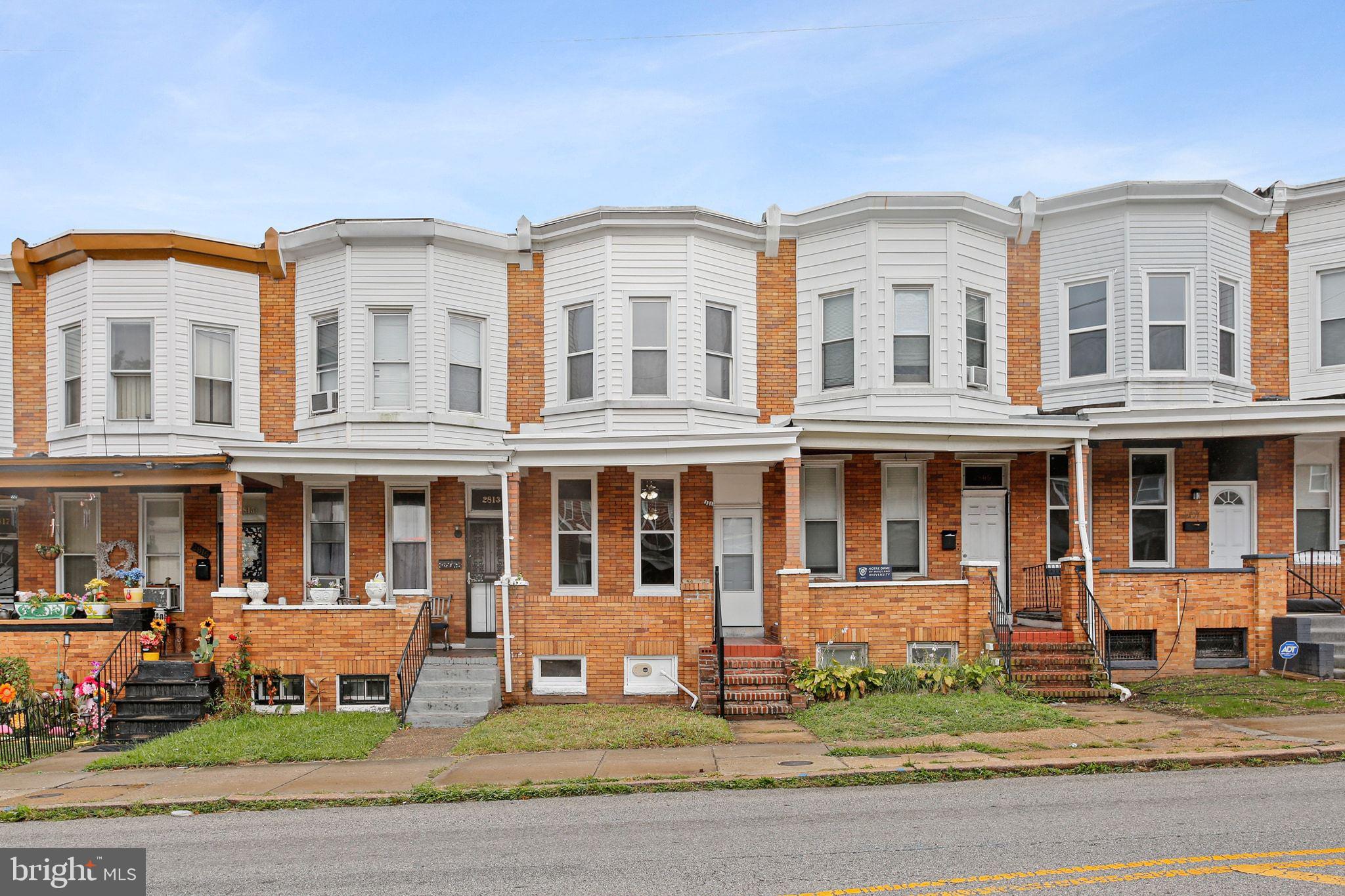 Welcome to this beautifully updated brick-front Baltimore City rowhome, where timeless charm meets modern finishes throughout. A covered front porch sets the tone before stepping inside to a bright, light-filled family room showcasing durable LVP flooring and recessed lighting that seamlessly flows into the dining area—perfect for both everyday living and entertaining.

The stunning gourmet kitchen is sure to impress, featuring updated stainless steel appliances, stylish pendant and recessed lighting, a designer glass tile backsplash, and continued LVP flooring for a cohesive, contemporary feel. Step directly onto the rear deck, ideal for relaxing mornings, summer gatherings, or expanding your entertaining space outdoors.

The upper level offers three comfortable bedrooms with updated plush carpeting and ceiling fans, including a spacious primary bedroom enhanced with recessed lighting. A beautifully finished full bathroom completes the upper level, showcasing ceramic tile flooring and a tiled shower with a custom built-in niche.

The finished lower level provides exceptional additional living space, highlighted by a generous rec room with recessed lighting, a second full bathroom, and a convenient walkout to the private, fully fenced rear yard perfect for future parking pad or off street parking. Blending comfort, style, and functionality, this move-in ready home is a standout opportunity with convenient access to dining, shopping, entertainment, and major commuter routes.