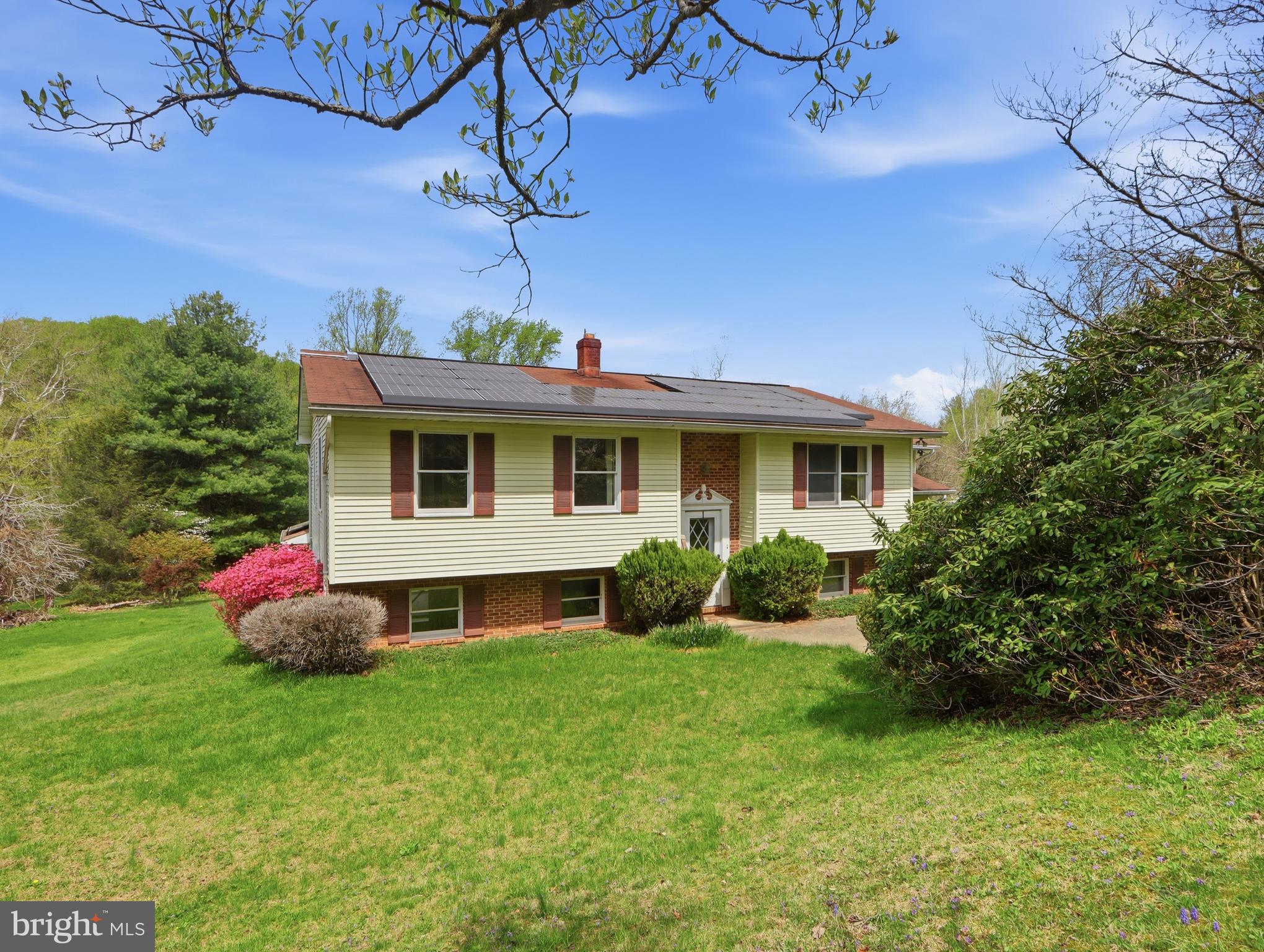 This spacious home-- A classic Split Foyer design with excellent flow sits on a stunning 3.15 acre lot, With a generous layout and solid bones, it is ready for a cosmetic refresh to truly shine.  The Sunroom / Family room, with windows on three sides, is flooded with natural light bringing the beauty of nature indoors  With abundant  space it easily accommodates  family gatherings and  entertaining .  The Lower Level offers a  Multi-purpose/Rec-room  with built-ins and walk-out access to the 2nd Sun Room, for a perfect view of the awesome and private acreage.  The wood stove adds extra warmth on any chilly winter day. Additional space used for a workshop Laundry and utility room, can readily be reconfigured to add another Bedroom, a Home Office or Personal Work-out room. You'll find  two adequate size bedrooms on the main level with the original 3rd entry door and closet in place, making it convenient to  convert back to three bedrooms, if needed.  Just off the formal dining area, the charming alcove offers a panoramic, wide-angle view of the property's expansive, manicured lot. It is a perfect place for a reading nook or a scenic morning coffee spot while enjoying the peace and serenity of your 3.15 acres.
This home has lots of potential  - Sold as-is, it is a rare find for a Contractor, DIYers, or anyone searching for a large home with significant acreage. Bring your vision and creative touch to  transform this house into YOUR HOME!  Schedule your tour today and see the endless possibilities for yourself,,,