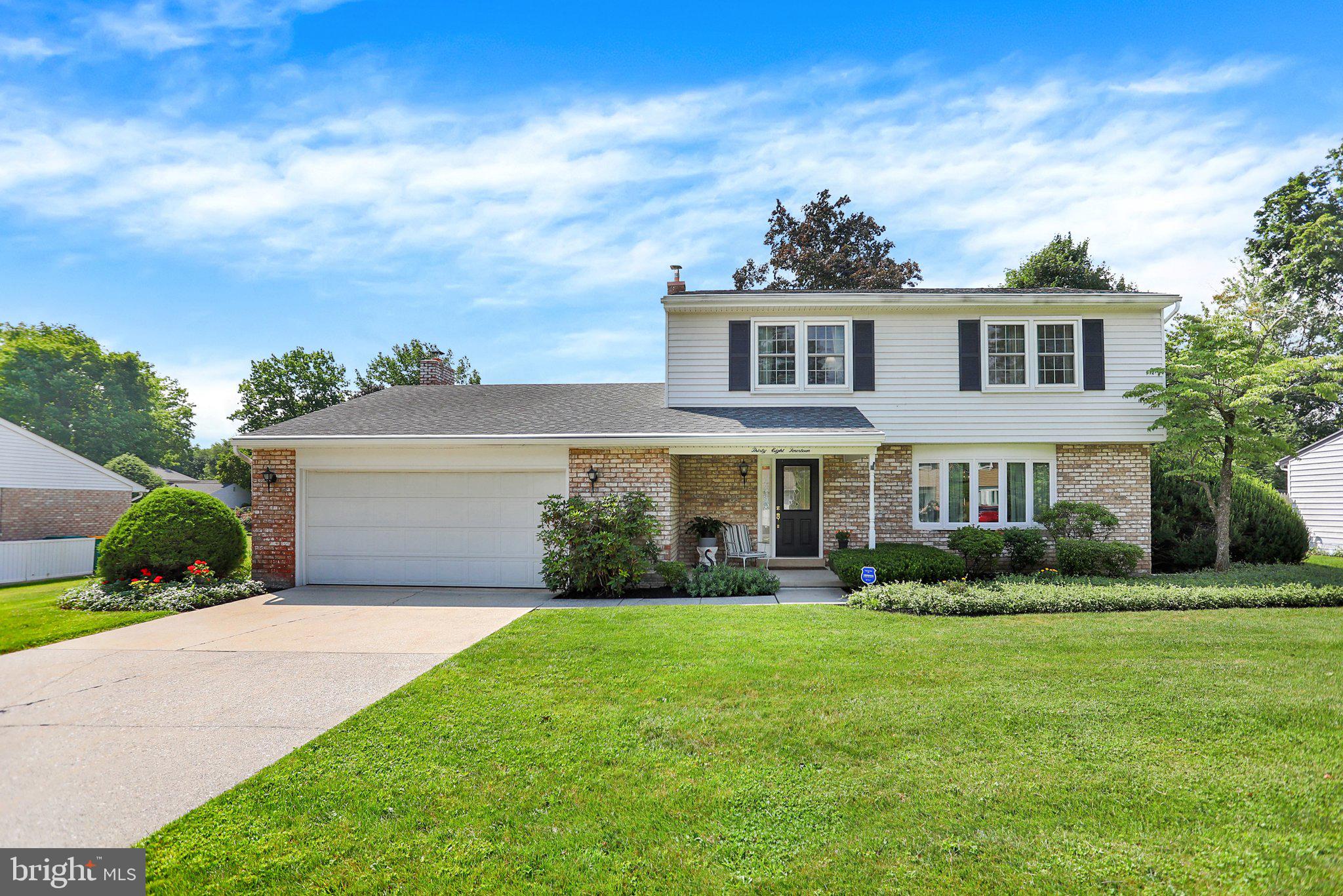 You will fall in love with this very well kept traditional 2-story 4-bedroom, 2.5 bath home in the popular Pine Brook Community of Hampden Township and Cumberland Valley School District.  You will be immediately wowed by the spacious and inviting front porch and lovely door entry.  Pride of ownership is manifested in every room of the home's interior with updated luxury vinyl tile installed in many of the floors and a bright kitchen boasting a tray ceiling with recessed lighting and cream-colored solid surface countertops.  Enjoy the stainless-steel refrigerator and dishwasher which are relatively new.  Since there is natural gas available, you can easily replace the current electric stove, and wall oven with a gas range to enhance the eat-in kitchen setup.  The Great Room off of the kitchen has a breathtaking cathedral/vaulted ceiling and cozy brick-faced gas fireplace with built-in bookshelves and a picture window looking out onto the rear patio and private yard. The dry bar, bar stools and shelving above the bar remain for your entertaining enjoyment.  A fire-safe door was recently installed into the garage from the Great Room. The main level has a formal dining room with vintage chandelier included. The living room is quite large, and the piano can remain.  The large bay window allows a host of natural light to pour into the living room and dining room areas.  A half-bath off the open marble-floored foyer rounds out the features of the main level.  The laundry closet is located between the kitchen and great room, and the washer and gas dryer stay. Venturing up to the 2nd level you will be pleased to discover 4 bedrooms (one of which is the large primary suite with a walk-in shower in the adjoining bathroom). Each of the additional 3 bedrooms are of ample size and closet space.  All window treatments are included in all bedrooms and living area windows.  Most of the basement level is finished and one room has an additional bar with barstools, and the other bonus room could have multiple purposes, as well.  The 2016 gas furnace and A/C unit are regularly serviced. There are 2 sump pumps and 2 dehumidifiers in the lower level to ensure a dry atmosphere down there.  As you step outside you will notice the beauty of the landscaping and well-manicured yard.  The private rear patio is an oasis perfect for entertaining guests or just enjoying a book or morning/evening beverage.  A corner of the rear yard presently contains a garden area.  Schedule your tour of this lovely property today and experience the best of Pine Brook right here!