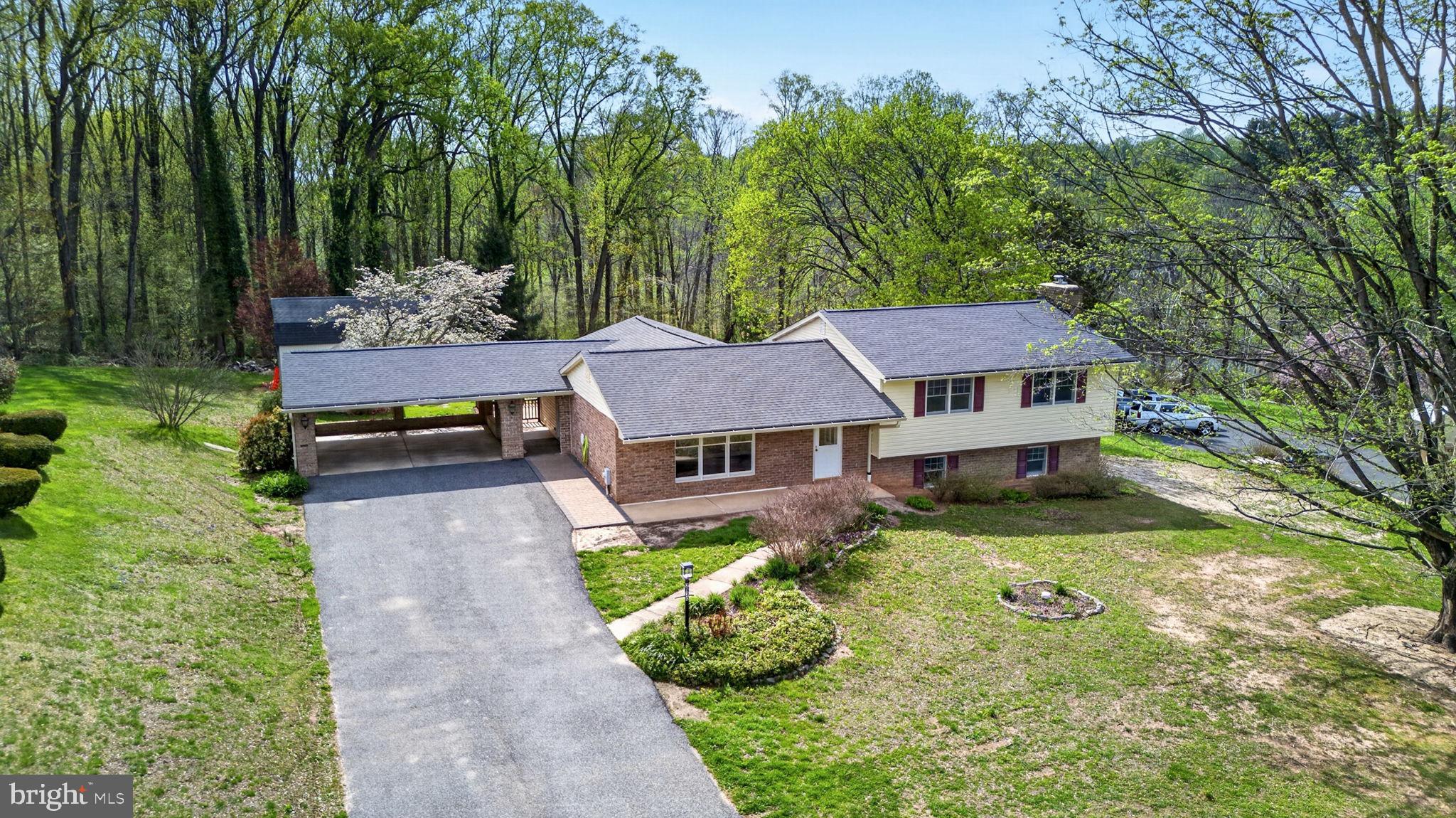 This spacious split-level has over 2,500 sq feet and features an updated lower level in-law suite with bedroom, kitchen with stainless steel appliances, living room with fireplace, full bathroom/laundry room and walkout to patio rear yard.  Main level offers a convenient laundry room, sun room leading to spacious deck, large kitchen, formal living and dining rooms.  Lots of potential in this spacious home in desirable neighborhood!  Some cosmetic updates/finishes are needed.

The rear yard has a shed, storage barn, deck and patio. Part of the yard is fenced in, property line goes beyond fence.   

Updates include: paint (2026), power washing (2026), some windows (upstairs bedrooms and bathroom -about 5 years ago), roof (approximately 8 years old) and water heater (2021), stainless steel refrigerator in main level kitchen (approximately 1 year old), stainless steel refrigerator in in-law suite (approximately 5 years old).

Professional photos will be uploaded on 4/16