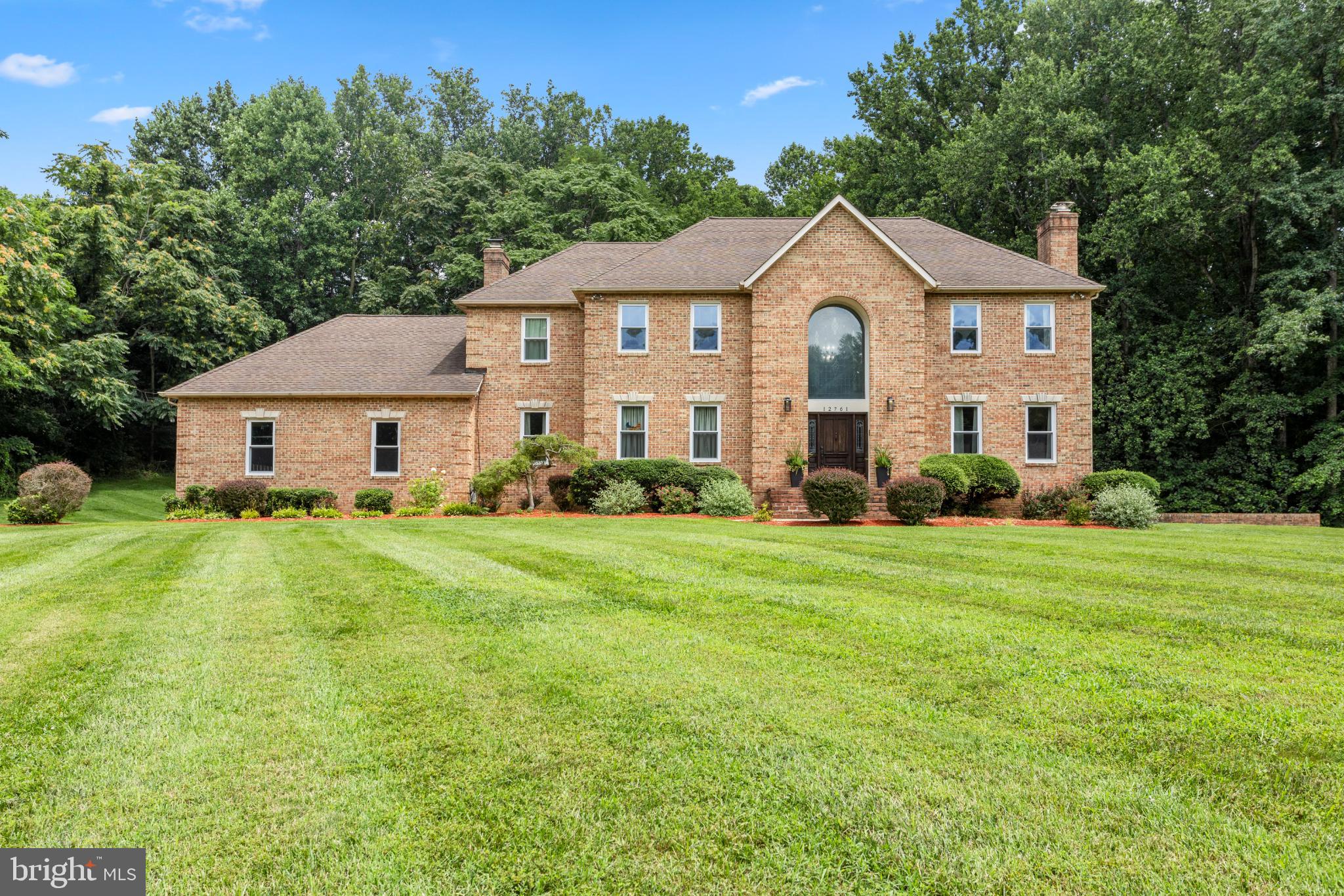 **Pride of ownership shows in this beautifully maintained home! Pre-listing inspections have been completed by the seller for buyer peace of mind. Ask your agent for details.
2 DRIVEWAYS for Extra Parking! 3.31-Acre Lot —  MAIN LEVEL BEDROOM WITH FULL BATH and walk-in closet, UPPER LEVEL LAUNDRY, Multi-Generational Living, Basement Living is equipped with a kitchenette with room to expand, bonus room and full bathroom. Privacy Awaits at the end of a cul-de-sac! Expansive living with this 5-bedroom, 5.5-bath, Brick Colonial Grand featuring 2-story foyer with a fully finished basement featuring its own bonus driveway and entrance. UPDATES GALORE in this HOME! New Radon detection and prevention system (2026), New Kitchen Wine Cooler (2026), New outlets and light switches throughout (2026), Electric Panels updated (2026), And, a BONUS WOW, New generator switch panel installed (2025), and new Generator (2025) included! Convenience for large families with most of these bedrooms having their own Private bathrooms. The spacious primary suite upstairs features a walk-in closet. Updated custom Quartz vanity, sinks and fixtures in the Primary Bathroom. Two separate areas to the Primary bathroom, enjoy the spa-like "take me away" area with soaking bath and the separated primary shower, vanity and toilet in its own room with a door. Continuing through the upstairs, two bedrooms with a Jack & Jill bathroom, and the third bedroom features a bathroom of its own with hallway access. Don't miss the amazing space above the garage, a Bonus flex room perfect for play, office, crafting or workout space. Hardwood floors and crown molding that flows into an elegant formal living room with brand new pellet fireplace (2025) and open concept to dining room. Update, bonus office space that leads right to the deck. Updated main level half bath, GOURMET kitchen with granite counters, center island cooktop (2022), stainless steel appliances, walk-in pantry, breakfast area. All-weather Sunroom off kitchen for morning coffee or entertaining in the open flowing concept from the kitchen, sunroom to the beautiful deck overlooking a peaceful backyard. Choose quiet time in either the formal or main living room both featuring a new pellet fireplace. TWO Staircases to the 2nd level, the Grand Foyer staircase and the staircase by the 3- car garage entrance to the home. More Upgrades & Improvements: 3 pellet stoves installed in fireplaces, August 2025. LeafFilter gutter protection (2025) - Upgraded water softener & filtration system (2025) - Full attic re-insulation for energy efficiency (2024) - New Dishwasher (2025) - Electrical updates: Ceiling fans/lights added to multiple rooms (2023) - Sunroom conversion: Bonus office with direct deck access (2024) - SmartHome sprinkler system: New controller & solenoids (2025) - New garage door spring & SmartHome opener (2024) - Invisible fence for pets (2023) - HVAC serviced & upgraded (2025) - Fresh paint in multiple rooms (2025) - Remodeled half bath (2025), driveway resealing (2025), New basement Insulated Glass door with SmartLock (2025) Previous listing updates noted, 14 new windows (2022) - 2 new HVAC units + air handler (2022) - Water heater (2016) Located minutes from North Beach BEACH & BOARDWALK, Chesapeake Beach, Herrington Harbour North & South, North Beach Boardwalk, and a variety of restaurants, shopping, parks and recreation. Close proximity to  Joint Base Andrews (19.3 miles), Fort Meade (20.8 miles), US Naval Academy (26 miles), Pax River (44.8 miles), Fort Belvoir (48.2 miles) and Pentagon about (35.3 miles)