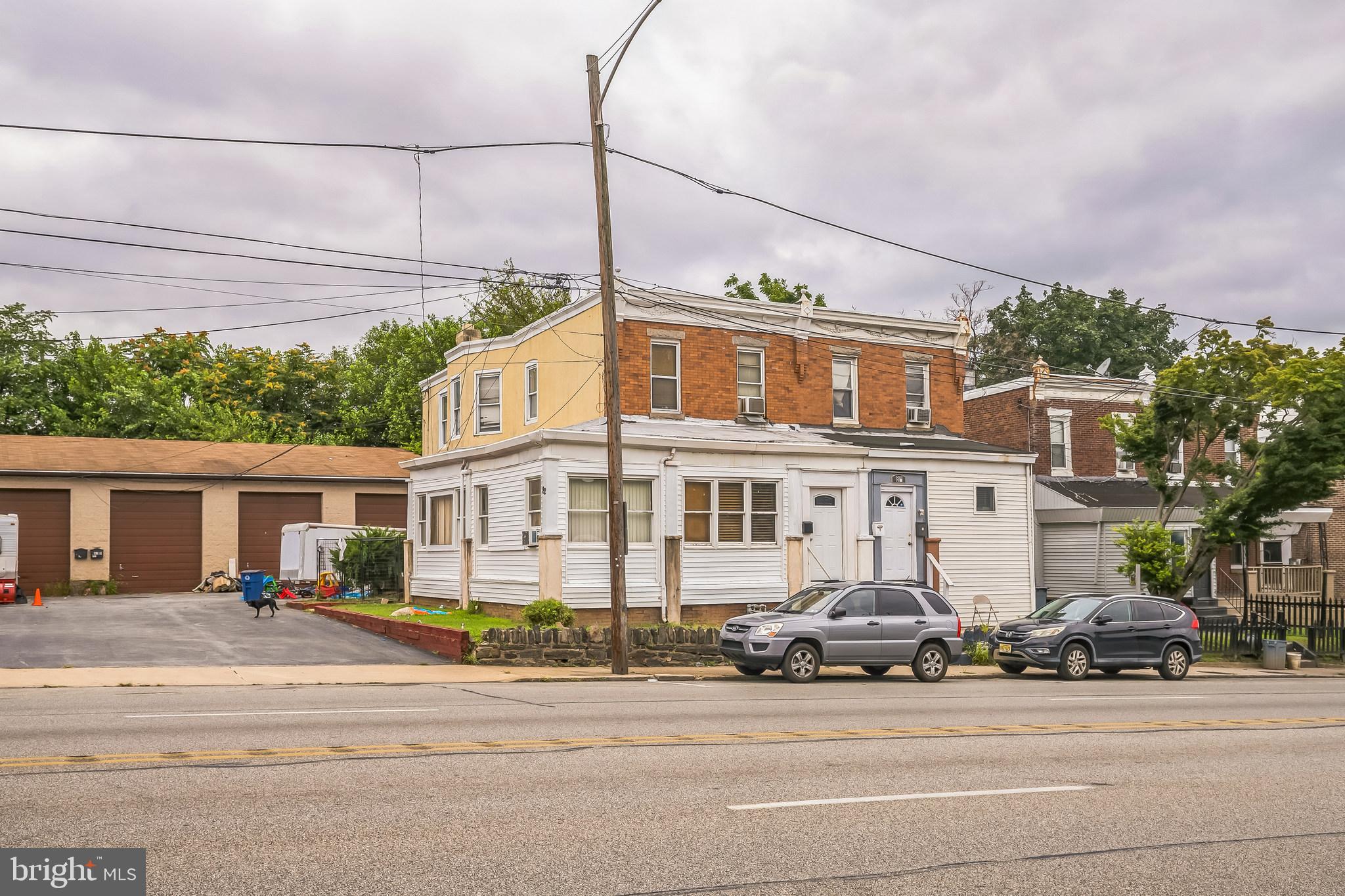 Exceptional investment opportunity at 82-84 Chester Pike featuring a profitable mixed-use commercial property with established long-term tenants and strong cash flow. This unique property consists of a 3-bedroom twin residence (1777 sq ft) with spacious eat-in kitchen and large laundry room, plus a massive 5-bay commercial garage facility (3139 Sq ft). The residential unit is leased through October 31, 2026 at $1,500 per month, while the commercial garage generates an additional $2,800 monthly. The impressive garage features five bays each measuring 15 feet wide by 47 feet deep with 14-foot ceilings, equipped with 10x12 foot garage doors and individual 100-amp electrical service with separate meters. Both tenants have maintained occupancy for 10-15 years, demonstrating the stability and desirability of this location. With a combined monthly income of $4,300 and proven tenant retention, this property offers immediate cash flow for the savvy investor. The property is being sold in as-is condition and represents an ideal opportunity for an investor seeking reliable rental income from established, long-term tenants in a prime Chester Pike location.