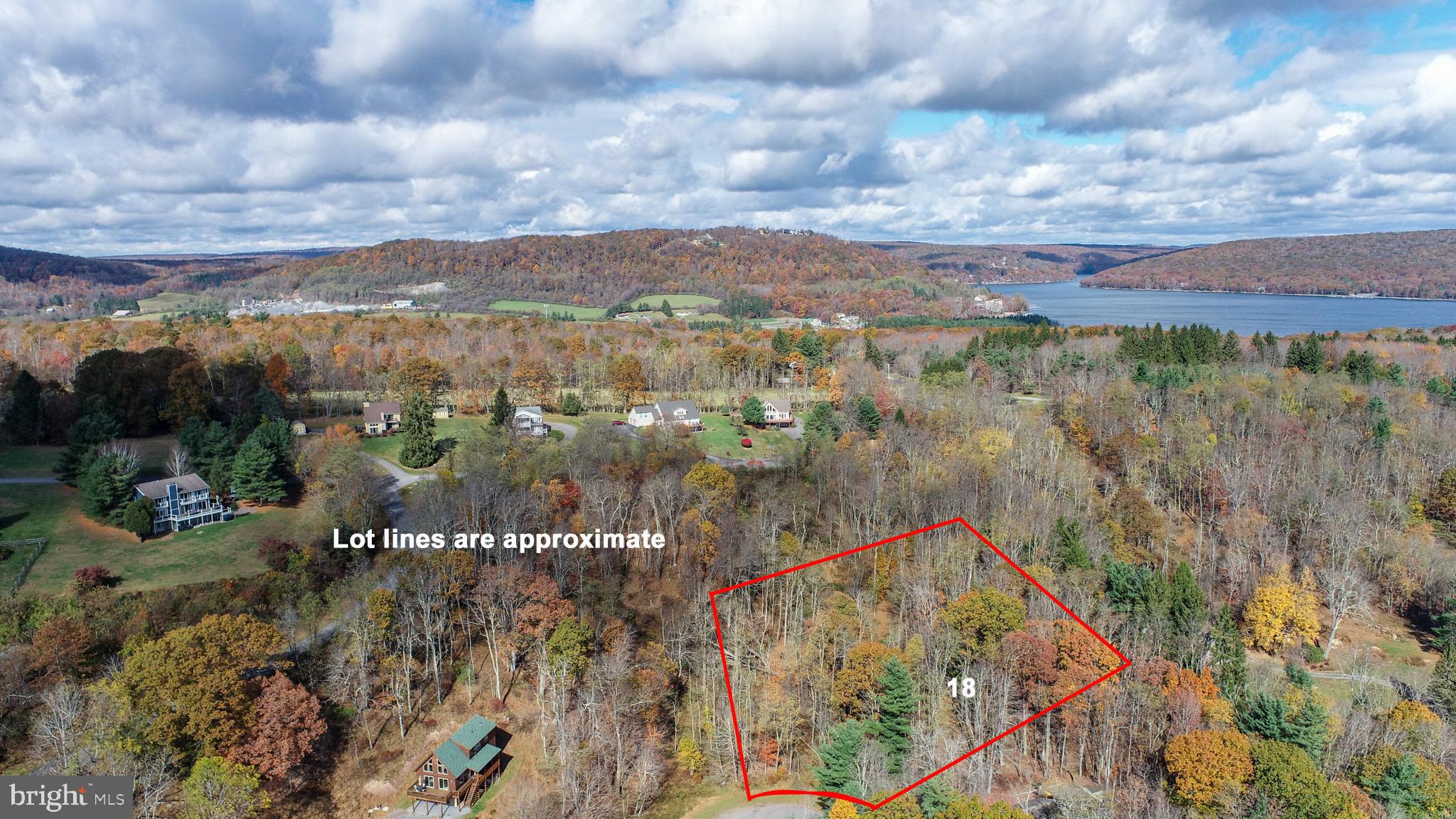 Discover the perfect setting for your Deep Creek Lake getaway on this beautiful 1.08-acre homesite located at the end of a quiet cul-de-sac in the desirable Paradise Ridge community. Lot 18 Laurel Court offers a peaceful, private setting surrounded by mature trees and mountain views. Paradise Ridge features one of the nicest lake access areas on Deep Creek Lake—perfect for swimming, kayaking, and soaking in the lakefront lifestyle. Enjoy paved, community-maintained roads, underground utilities, and a convenient location just minutes from Wisp Resort, restaurants, and area attractions. Whether you’re planning your dream vacation home or a year-round retreat, this property offers an exceptional combination of privacy, location, and lake access. There is a small wetland area on the property. Engineering reports are on file, as well as building plans that a buyer can utilize if they would like.