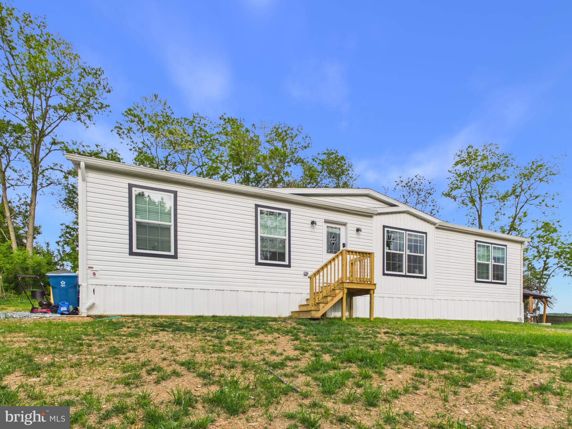 Check out this spacious almost 2 acre lot featuring a  recently constructed beautiful 3-bedroom, 2-bath modular home located in a peaceful country setting. The home offers modern comfort and an inviting open layout designed for both everyday living and entertaining.

The stylish kitchen features a center island, stainless steel appliances, and ample cabinet space with a walk in pantry, flowing seamlessly into the large family room. The spacious primary suite includes a walk-in closet and a private bath highlighted by a stunning tiled walk-in shower. Two additional bedrooms, a second full bath, and convenient main-floor laundry complete the interior.

Outside, enjoy your own private retreat with a sauna, gazebo, greenhouse, and storage shed — perfect for relaxing, gardening, and extra storage. With plenty of room to enjoy both indoors and out, this property offers the ideal blend of comfort, privacy, and country living.