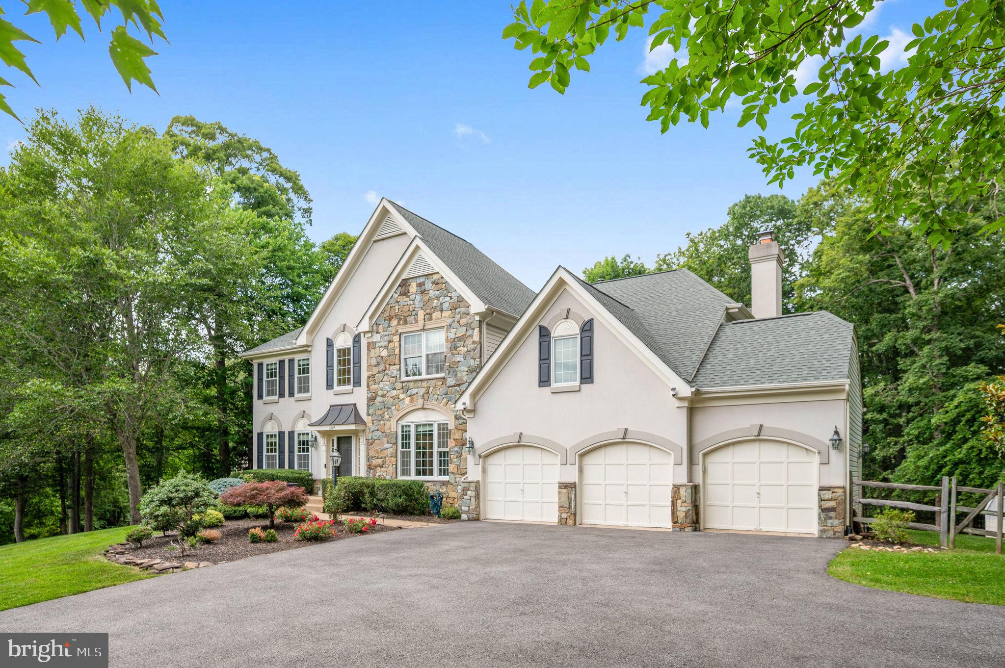 BRING ALL OFFERS! 🖊️ 
💫 HIGHLY RATED SCHOOL DISTRICT • PRIVACY & LUXURY • VALUE-PRICED FOR IMMEDIATE SALE💫

Welcome home to this stunning luxury estate, beautifully nestled among the trees on a serene 1.58-acre lot. Offering 4 bedrooms, 4.5 bathrooms, and a 3-car garage, this immaculate residence seamlessly blends sophisticated design with premium mechanics, offering ultimate privacy without isolation.

Premium Capital Improvements & Peace of Mind:
Power Security: Generac backup generator system
2025: New hot water heater, new washer and dryer
2022: 20 premium Thompson Creek windows; asphalt driveway fully repaved (3" cap)
2021: Detached storage shed; custom multi-level Trex deck with integrated lighting; stamped concrete patio and built-in fire pit
Roof: Approximately 10 years old

Elegant Living Spaces
Inside, a grand two-story foyer with warm hardwood flooring and a prominent staircase welcomes you into an elegant living room filled with natural light, plush carpet, and classic crown molding. The formal dining room features dual bay windows showcasing tranquil, wooded views.

The gourmet kitchen is a chef’s dream, boasting gleaming granite countertops, pristine white 42” cabinetry, a designer backsplash, a large pantry, double wall ovens, a smart refrigerator, and a center island with a gas cooktop. Earth-toned tile floors flow into a sunroom with a soaring cathedral ceiling and a wall of windows. Sliding glass doors lead to the spectacular multi-level deck and custom stamped concrete patio with a fire pit, an idyllic backyard oasis with dedicated garden and play areas surrounded by majestic woodlands, perfectly combining indoor and outdoor entertaining.

The adjacent family room centers around a dramatic floor-to-ceiling stone fireplace, complemented by a private home office with built-in bookcases, a powder room, and a practical mudroom.

Upper & Lower Level Retreats
The upper-level owner’s suite features a deep tray ceiling, a palatial walk-in closet with custom organizers, and a romantic three-sided gas fireplace shared with a private sitting area. The luxury en-suite bath features a dual-sink vanity, a Jacuzzi tub, and a glass-enclosed shower. Three additional spacious bedrooms feature lighted ceiling fans and share either a private bath or a well-appointed Jack-and-Jill bath.

The finished walk-up lower level features a massive multipurpose recreation room zoned for games, exercise, and media/theater space, plus a full bath. Two additional finished rooms offer total flexibility for guest quarters or a second office, while a large unfinished utility room/workshop provides abundant storage.

Secluded Yet Connected
Enjoy effortless access to Route 234, the Prince William Parkway, I-95, Express Lanes, and the VRE, putting shopping, dining, and commuter routes minutes away. Explore nearby Prince William Forest Park, offering 15,000 acres of outdoor recreation. Schedule your showing today!