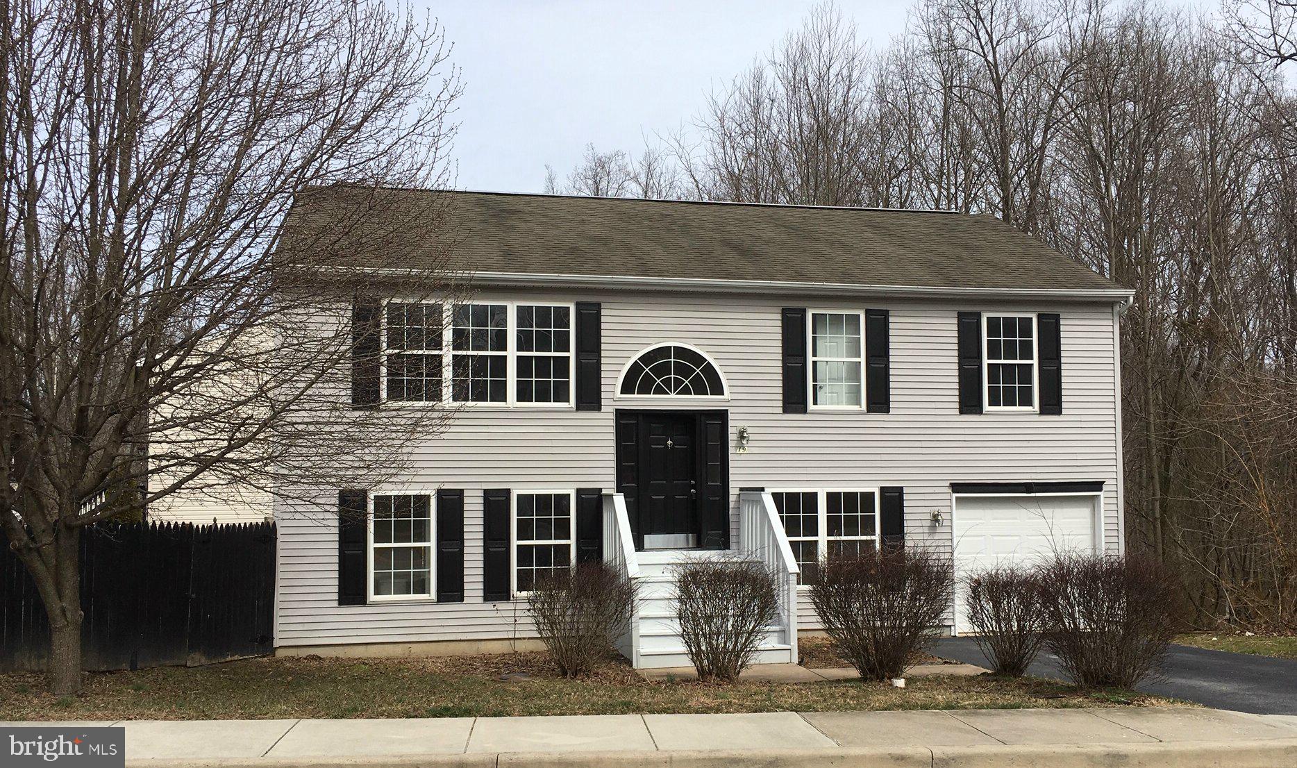 Nicely rehabbed bi-level now available! This house is less than 20 years old and features updated eat in kitchen, with granite counters and stainless appliances. 3 bedrooms upstairs, one with access to Jack and Jill bathroom. Lower level features another large bedroom with huge walk in closet and another full bath. Finished living room in basement opens to backyard deck, with easy access to private fenced yard. One car attached garage with nicely paved driveway. Energy efficient Rinnai propane hot water heater instantly heats water when you need it. Open living room is flooded with natural light making this one you don't want to miss. See it today!