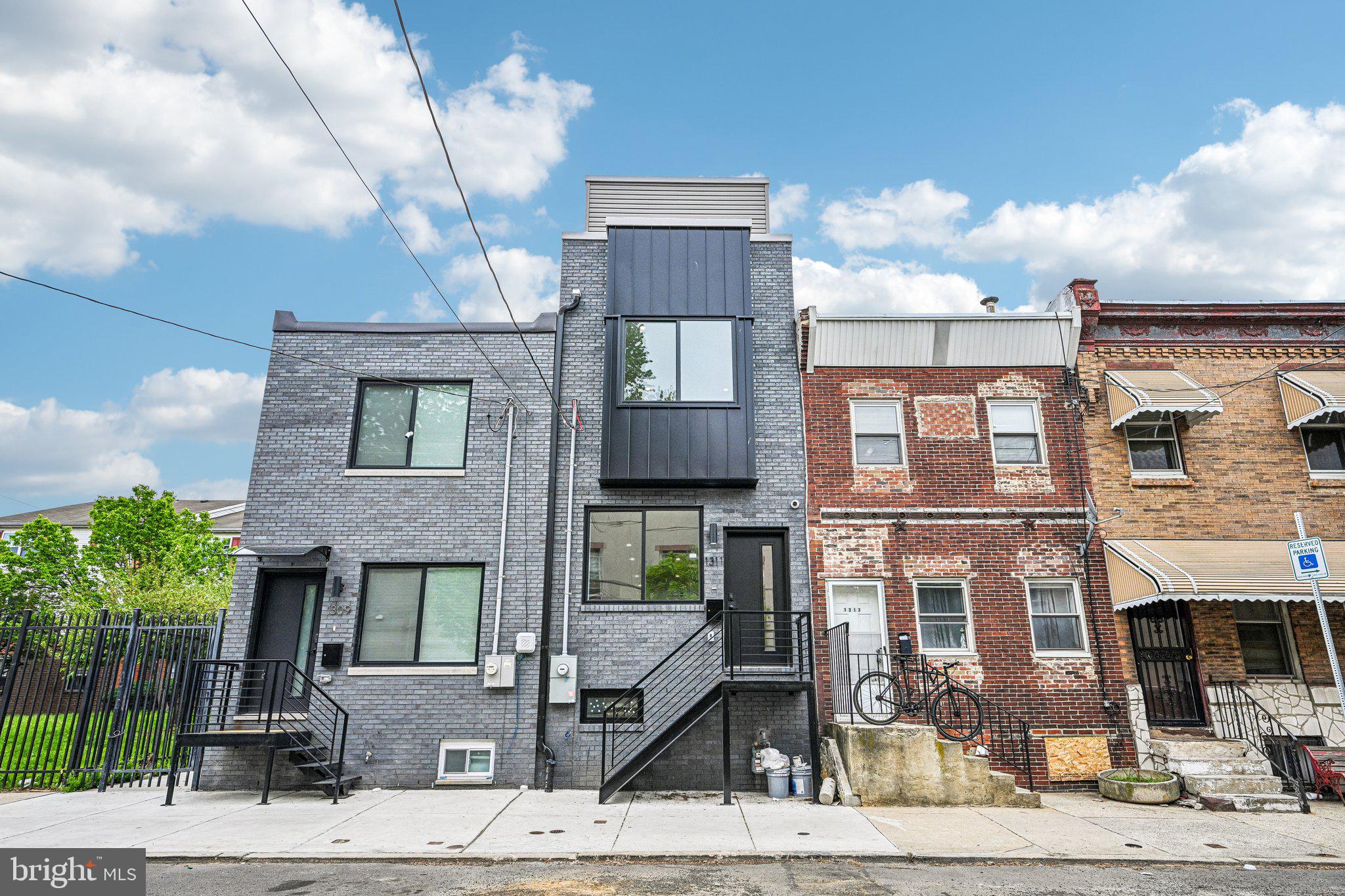 We can settle ASAP! This roof deck could be yours for the 250th Celebration Fireworks! The finishes are fantastic!!  Welcome to 1132 S. 32nd Street, a new constructed, custom-crafted gem in Grays Ferry. This four-story residence features soaring 9-foot ceilings on the first two floors, 4 spacious bedrooms, and 3 ultra-modern baths, each showcasing European toilets, sleek fixtures, and glass shower doors. Custom wood flooring runs throughout, and a finished lower level with Private Office/bedroom space, sitting area, full bath which expands your living space.

The gourmet kitchen is a centerpiece, offering quartz countertops, premium appliances, and dedicated wine storage. Floating steps, accent-lit, connect each level, while the roof deck offers breathtaking skyline views just in time for the summer, a bar, and entertaining space. A custom wood fenced rear yard adds privacy.

This home’s luxury extends to its unbeatable location. You’re minutes from Center City and South Philly’s cultural gems, including the 9th Street Italian Market. Commuting is seamless with quick access to I-76, I-476, subways, and trains. Plus, you’re close to Manayunk, Roxborough, the Main Line, and abundant shopping. This is refined living paired with unmatched convenience—a rare find.