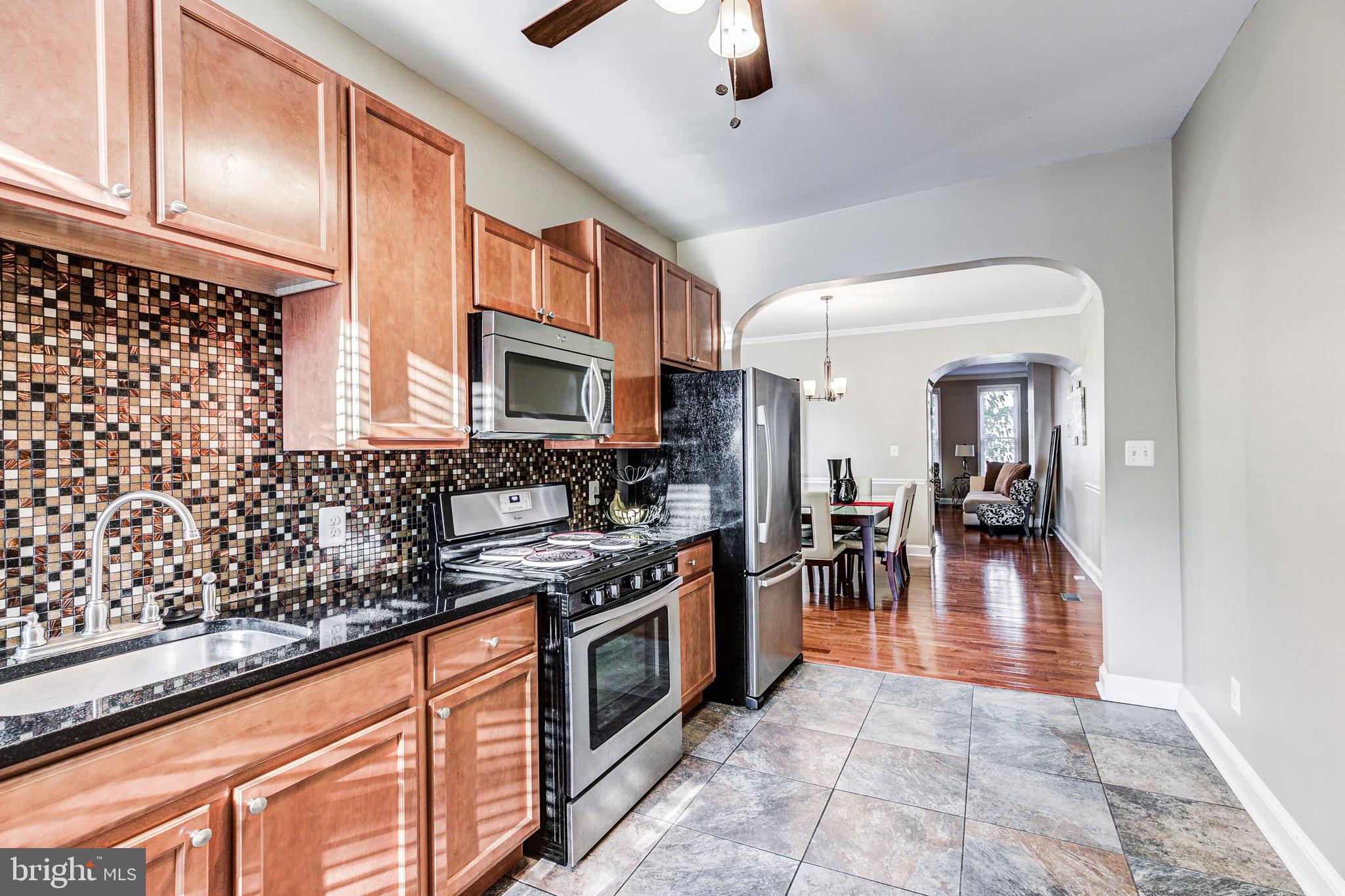 Major Price Reduction!! Make this home yours for the Holidays. Welcome to your urban oasis in the heart of Baltimore's thriving Oliver neighborhood! This charming and spacious 3bd/1.5ba rowhome is an absolute gem, boasting an updated interior that is sure to steal your heart. Step inside and be greeted by the warmth of hardwood flooring, tasteful crown molding, and an open, inviting layout that's perfect for both relaxation and entertaining. The kitchen, adorned with sleek granite countertops and gleaming stainless steel appliances, is a culinary enthusiast's dream come true. But that's not all – the magic continues downstairs in the finished basement, offering endless possibilities as a cozy den, home office, or recreation space. Upstairs you will find three large bedrooms, spacious closet space, a new front load washer and dryer for convenience,  and an updated bathroom. With a location just minutes from Penn Station, the vibrant Station North Arts District, and the heartbeat of downtown Baltimore, you'll enjoy the city's culture and convenience at your doorstep. Schedule a tour today so that you can pack your bags and move right on in!