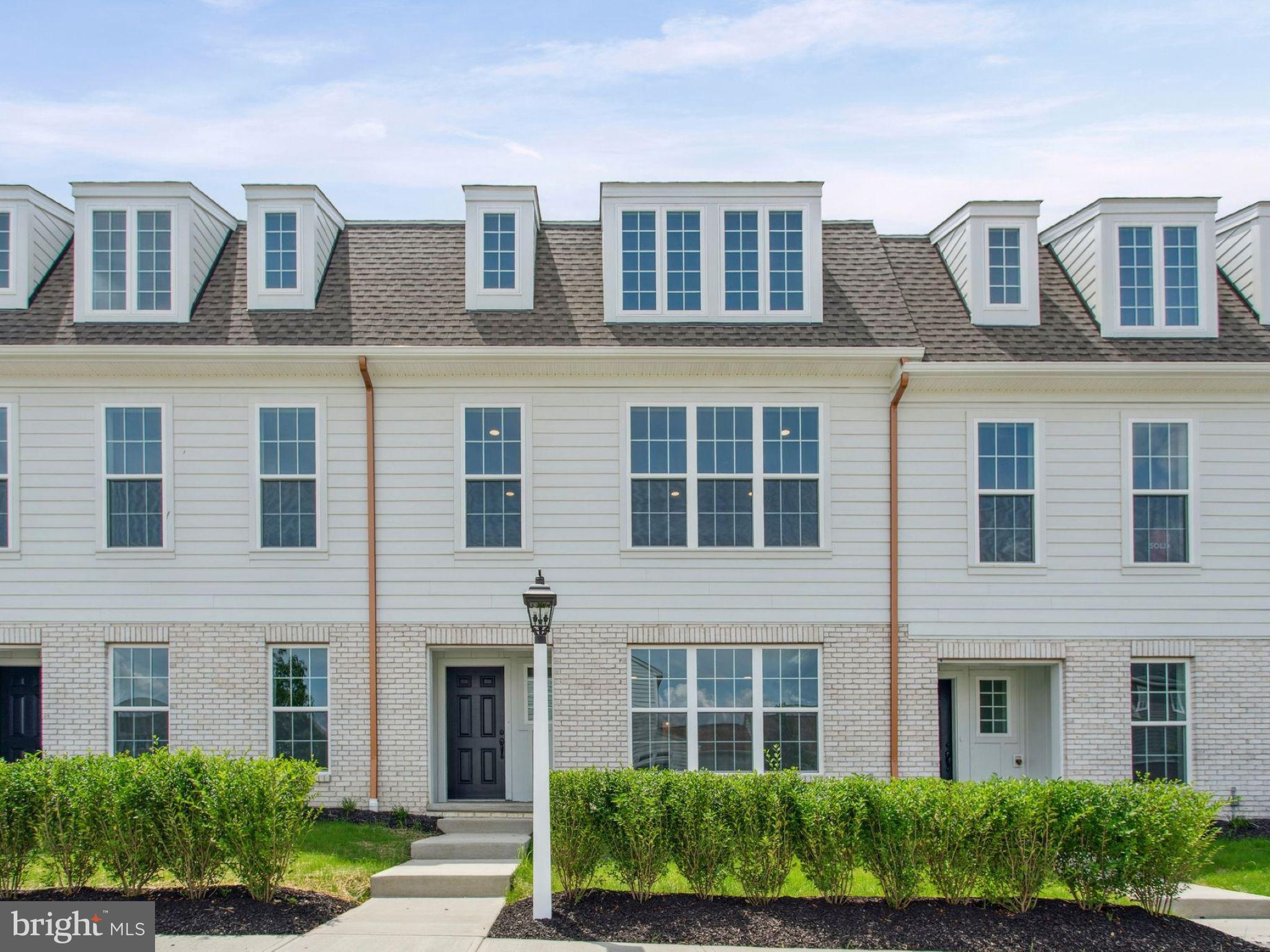 These thoughtfully designed townhomes offer 1,820–2,157 square feet of stylish, flexible living with 3 bedrooms, 2–3 full baths, and an attached 2-car garage. With only four opportunities available, this is a one-of-a-kind townhome that lives like a single-family home. An exterior full of character and charm welcomes you in, while the refreshed interior layout is tailored for modern living. The entry level features a covered porch and a versatile unfinished space ready to fit your needs—create a cozy lounge with a full bath, a game room, or the ultimate movie night retreat. A beautifully appointed kitchen features maple cabinetry, granite countertops, a large center island, and stainless steel appliances, all flowing seamlessly into the tandem living and dining areas filled with natural light. The main-level garage makes coming and going effortless—no stairs, just easy access. Upstairs, an expanded gallery provides the perfect nook for a desk or reading space. Two secondary bedrooms and a full bath are privately set apart from the spacious primary suite, complete with charming dormer windows. With limited homesites available, now is the time to act—buyers still have the opportunity to personalize selections. Low-maintenance living, smart design, and rare availability—don’t miss your chance. Ready by the new year. Located on a picturesque hillside in historic Mount Joy Borough, Florin Hill offers green spaces, a neighborhood pool, playground, coffee shop, salon, walking trails and more all within walking distance from your front door.