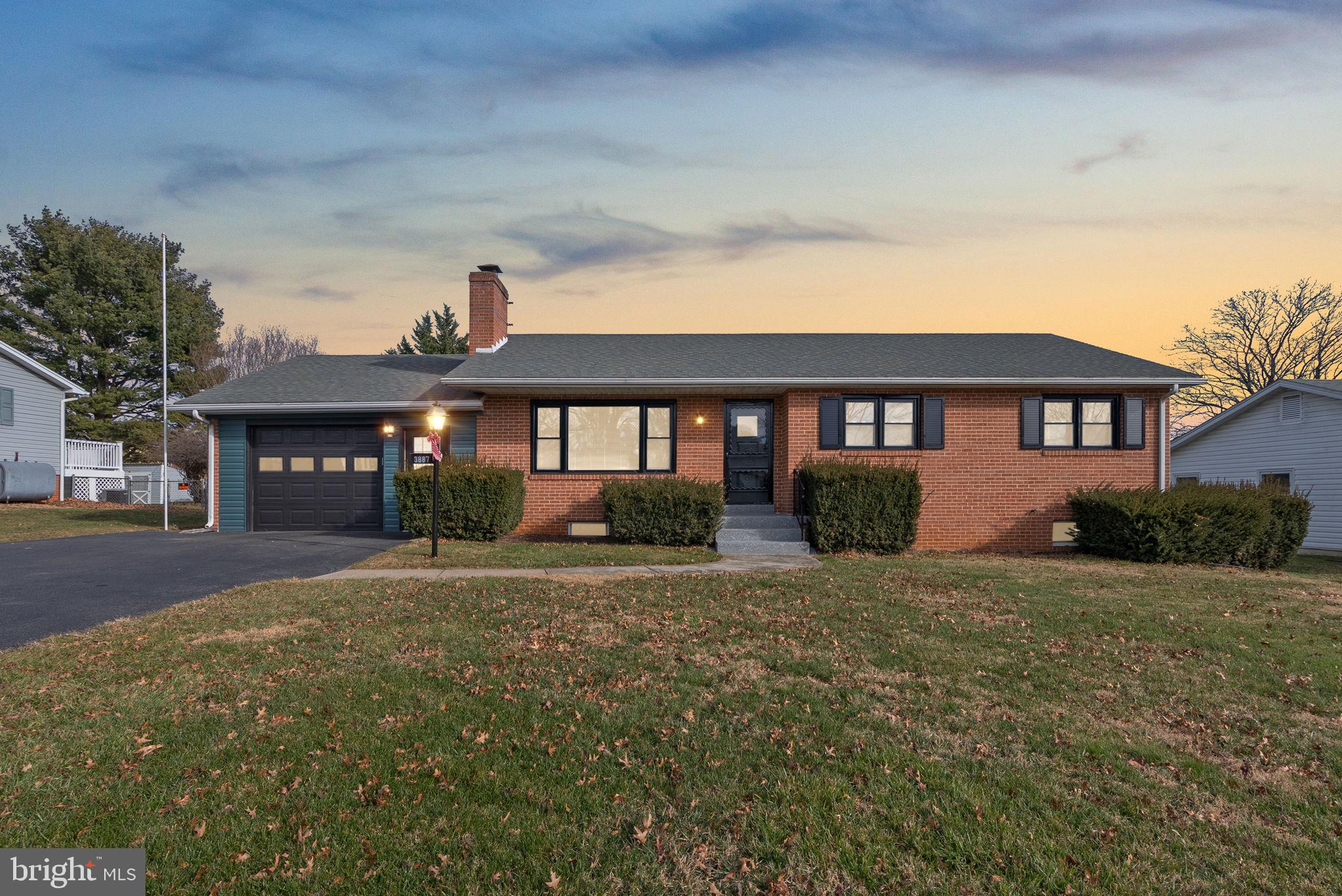 Welcome to 3887 Shadywood Drive — where country living meets a confident, modern edge. Tucked away on a serene, fully fenced lot in Jefferson, this brilliantly designed home offers a level of craftsmanship and personality that’s uncommon to find. This is not your average renovation — and definitely not another predictable greige flip.

Inside, the home unfolds with intention. The main level feels open and inviting, layered with elegant finishes, updated flooring, and thoughtful design choices that feel both refined and fresh. The kitchen anchors the space with contemporary style and functionality, flowing effortlessly into the living and dining areas for everyday comfort and easy entertaining. Three well-appointed bedrooms and two full bathrooms complete the main level, each finished with clean lines and modern touches that feel polished yet warm.

The lower level is where the home truly surprises. Designed for gathering and entertaining, the fully renovated basement features a custom wet bar, built-in entertainment center, and striking modern paneling — details you don’t expect, but will absolutely appreciate. A full bathroom adds flexibility, making this space ideal for hosting, relaxing, or creating a home office, gym, or guest retreat.

Outside, the deck overlooks a peaceful, private setting — perfect for quiet mornings, evening gatherings, or simply enjoying the surrounding nature. With no HOA, you’ll enjoy true freedom and privacy, all while being just minutes from local parks, golf courses, and nearby breweries. Plus, downtown Frederick is only a short drive away, offering dining, shopping, and entertainment whenever the mood strikes.

Uncommon details. Thoughtful design. A home that stands apart.

If you’re looking for country living perfection with a modern twist — this is the one.