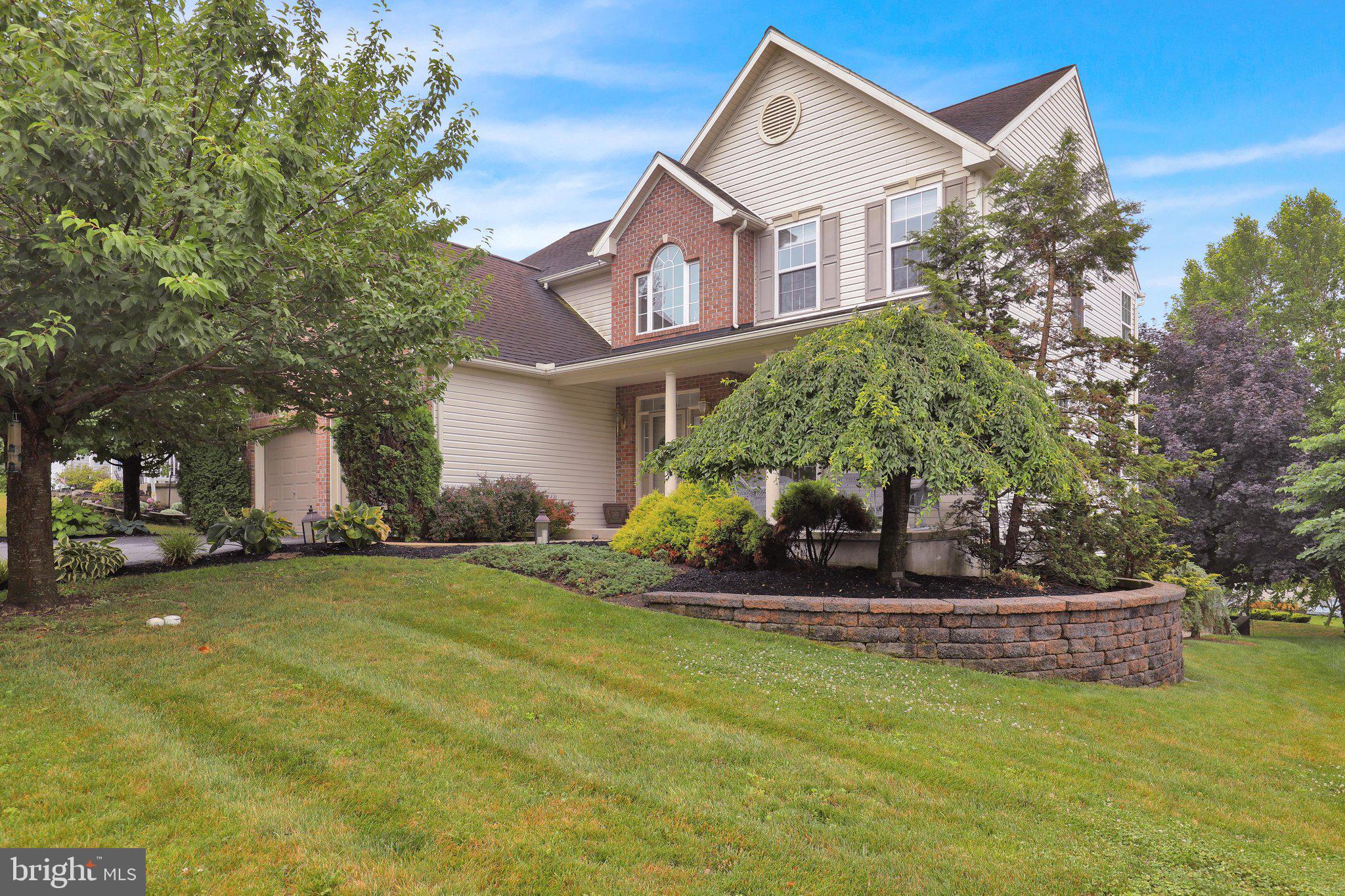 Welcome to this exceptional former Greth Model Home, located in the highly sought-after Bryn Mawr Estates within the Conrad Weiser School District. This beautifully maintained 4-bedroom, 2.5-bath home offers quality craftsmanship, timeless design, and the space today's buyers are looking for.
The inviting open floor plan features 9-foot ceilings throughout the first floor, creating a bright and spacious atmosphere that's perfect for everyday living and entertaining. The well-appointed kitchen flows seamlessly into the main living areas, highlighted by a cozy gas fireplace. Additional features include efficient gas heat, gas hot water, and newer, meticulously maintained mechanical systems, providing comfort and peace of mind.  Upstairs, you'll find a spacious and impressive primary suite along with a versatile bonus room that offers endless possibilities. Whether you're looking for a private home office, a fifth bedroom, a playroom, or an oversized walk-in closet, this flexible space can easily adapt to your lifestyle.  The walk-out basement is ready for your finishing touches, offering the opportunity to create even more living space. Outside, enjoy the Trex deck overlooking the beautifully landscaped yard featuring an EP Henry paver patio, retaining wall, level backyard, and a storage shed with electric service.
Combining exceptional curb appeal, quality construction, flexible living space, and a prime location, this former model home is a rare opportunity in Bryn Mawr Estates. Schedule your private showing and discover everything this outstanding home has to offer.