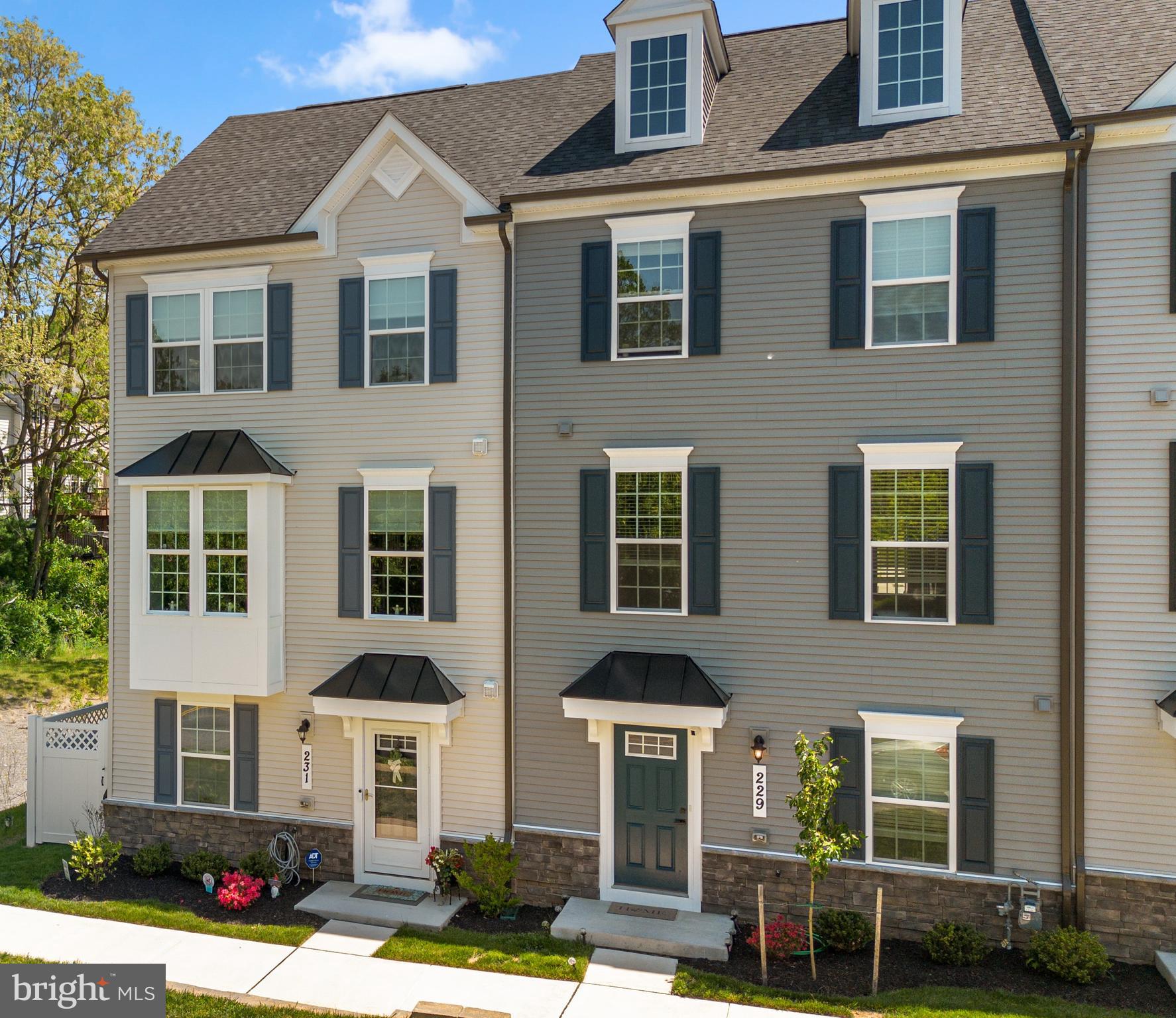 The love that the sellers have for this upgraded 3 bedroom, 2 full bathroom, 2 half bathroom end-unit townhome is apparent from the moment you walk in the front door. Built in 2025 and lightly lived in, this home offers the benefit of newer construction along with thoughtful upgrades selected at build time and after move-in. From the exterior to the interior, the property has been meticulously cared for and shows exceptionally well.
The main level offers an open floor plan with high ceilings and a strong sense of flow between the kitchen, dining area, and family room. The gourmet kitchen is a standout feature, complete with quartz countertops, a large center island with sink, five-burner stove, butler pantry, generous cabinet storage, and ample prep space. The separate dining area sits just off the kitchen and provides direct access to a spacious deck, enhanced by an added screen door. A separate family room creates a defined living area while maintaining the openness of the main level. A convenient half bathroom is also located on this floor.
The upper level includes 3 bedrooms and 2 full bathrooms. The primary suite features a tray ceiling, a large walk-in closet with custom built-in shelving and storage, and a private bathroom with dual vanities, a tub, and a separate shower. The additional bedrooms offer comfortable proportions and include installed lighting, one of several upgrades completed when the home was built.
The lower level expands the home’s usable space with an office/den/possible 4th bedroom, highlighted by custom barn doors. This level also includes a half bathroom and a large storage area, making it easy to keep seasonal items, household essentials, or hobby equipment organized. The garage has a finished epoxy floor, giving the space a clean and durable finish.
Additional upgrades include upgraded window treatments, lighting in all bedrooms, the finished garage floor, and the screen door leading to the deck. The end-unit setting adds to the appeal, while the location offers convenient access to walking trails, a nearby playground, Baker Park, Downtown Frederick, Starbucks, grocery stores, restaurants, shops, I-15, commuter routes, and the Frederick MARC station. A discounted YMCA membership is also available. This is a well-appointed townhome with modern finishes, practical upgrades, and a convenient Frederick location.