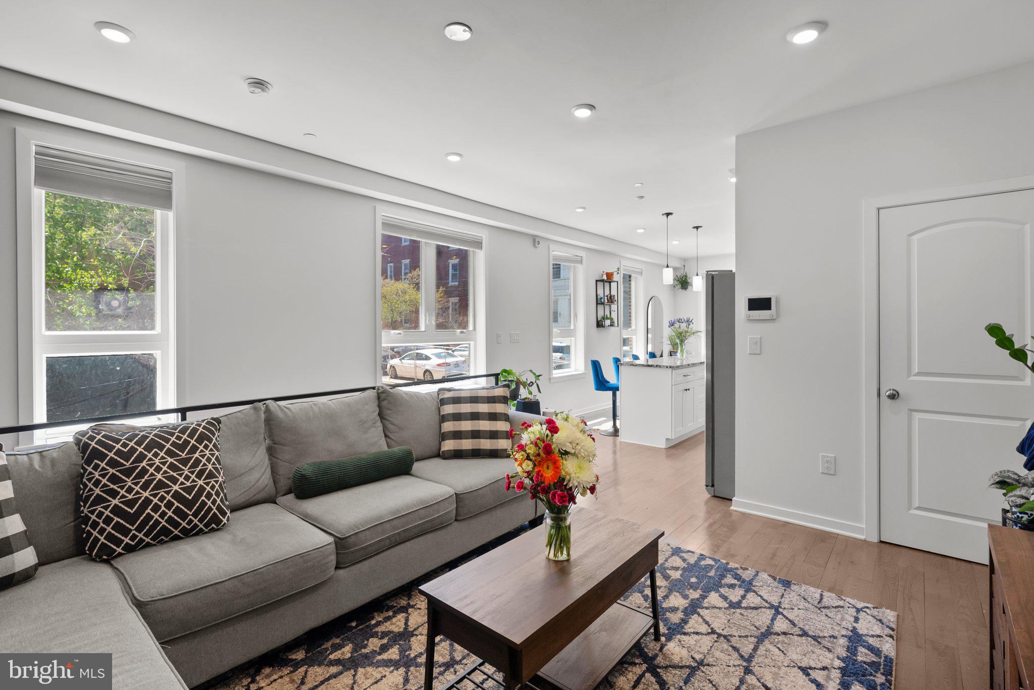 Welcome to 1213 N 15th St #A, modern city living one block from Fairmount! This spacious 2-bedroom, 2-bathroom bi-level condo offers an open, airy layout with hardwood floors throughout and tons of natural light pouring in from oversized windows. The main level is designed for everyday living and entertaining with a wide open concept living and dining area that flows into a modern kitchen featuring stainless steel appliances, a large center island, granite countertops, and plenty of cabinet space. The primary bedroom includes an en-suite full bathroom and great closet space, while the second bedroom is perfectly sized for a guest room, home office, or workout space. A second full bathroom adds flexibility for guests or roommates, and in-unit laundry makes life even more convenient. Out back, enjoy your own private backyard - ideal for grilling, gardening, or just unwinding at the end of the day. This home has an abundance of closet space! 
** With 3.5 years remaining on the tax abatement, this home offers even more value for city living.** You’re just blocks from local landmarks like the Divine Lorraine, the Met, and Temple University, with quick access to the Broad Street Line at Girard Station just a 2-minute walk away. A bright, modern space in a prime location - this is city living done right.