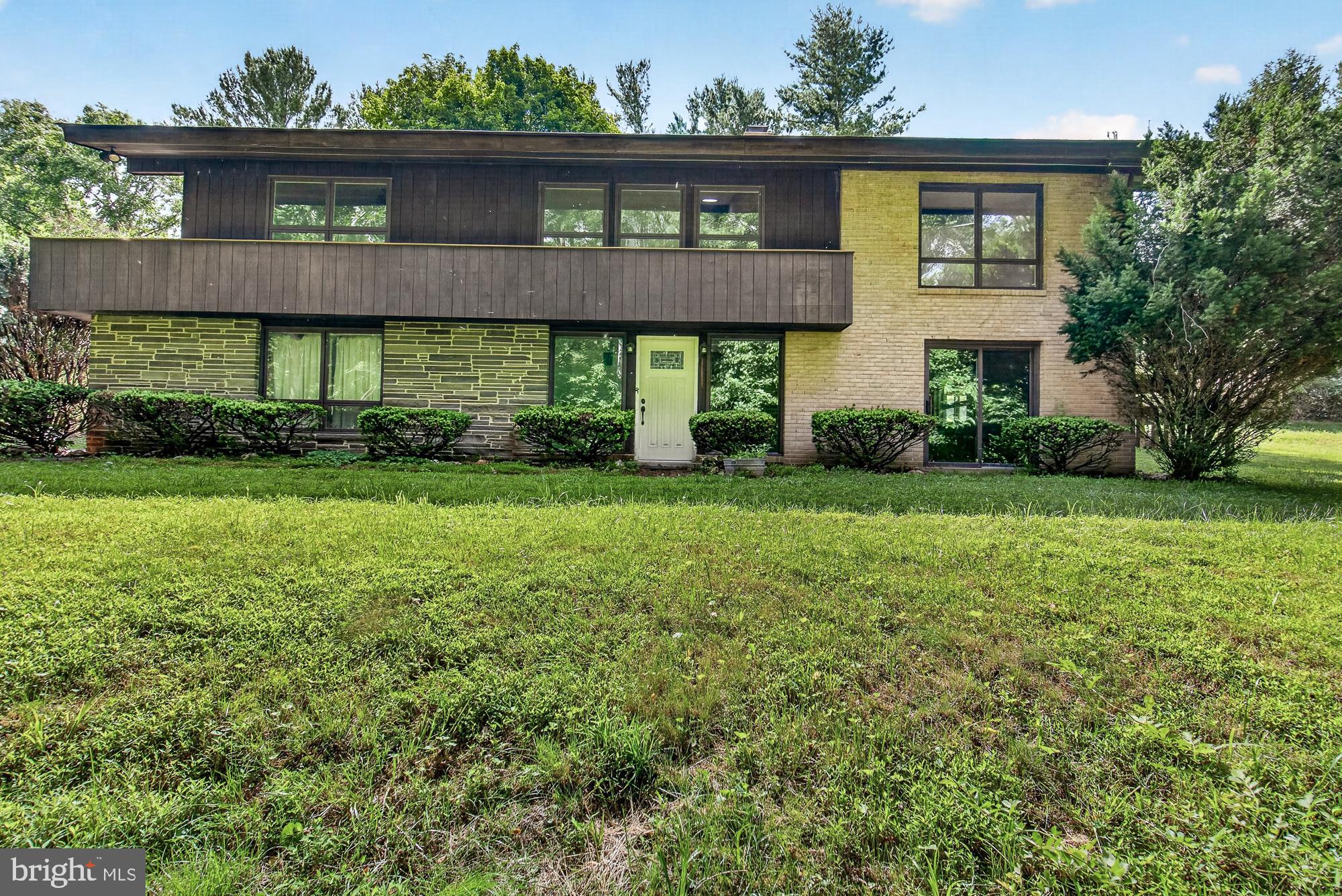 Welcome to your own private retreat! This 3-bedroom, 3 full bath home offers nearly 2,500 square feet of finished living space and comes with not one, but two parcels totaling approximately 7.63 acres. The home is situated on 5.90 acres and includes an additional 1.73-acre wooded lot located directly behind the property, providing even more privacy and future possibilities.

Inside, you'll find beautiful wood flooring throughout the main level and a spacious layout designed for comfortable living. The primary suite features its own private full bath and direct access to a deck overlooking the peaceful surroundings. Two additional bedrooms and a full bath complete the main level.

Enjoy the outdoors from the wraparound rear porch or entertain guests on the expansive two-tier deck. During the colder months, cozy up beside one of the home's two wood-burning fireplaces. The lower level offers additional living space along with a third full bath, making it ideal for a recreation room, guest area, or home office.

With plenty of driveway parking and a 2-car attached garage, there is ample room for vehicles, equipment, and guests. Conveniently located just minutes from downtown Middletown and within the highly sought-after Middletown School District, this property offers the perfect combination of privacy, acreage, and accessibility.