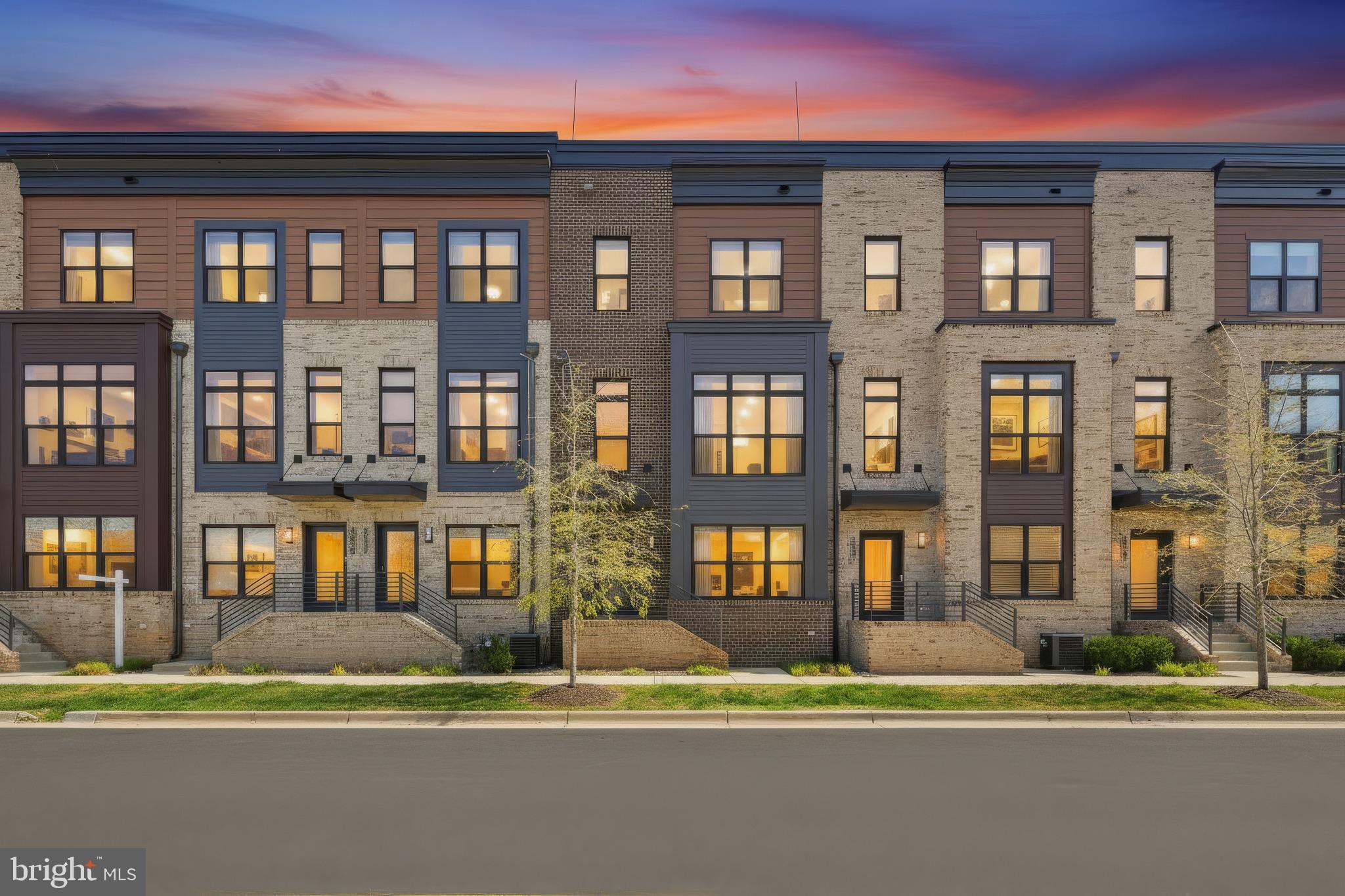 PRICE IMPROVEMENT!! NOW THE ONLY LUXURY TOWNHOME UNDER $1M - DON’T MISS THE BEST DEAL IN THE NEIGHBORHOOD! Seller offering a credit to Buyers! Experience elevated luxury in the prestigious Tower Oaks community, where tranquility and convenience meet. Set in a quiet, tucked-away enclave yet moments from I‑270, this residence offers effortless access to neighborhood favorites like Clyde’s Tower Oaks Lodge and nearby parks—just a short stroll across the street.

Residents enjoy exclusive access to the CORE clubhouse, a vibrant, amenity-rich retreat featuring a state-of-the-art fitness center, yoga studio, seasonal pool, weekly Hearts, Canasta, and Mahjong games, creative arts and crafts space, and cozy seating nooks perfect for unwinding. Heated outdoor patios with grill stations, community happy hours, and visiting food trucks create a warm, social atmosphere for those who value both privacy and connection.

Completed in 2021, this four-level EYA townhome is perfectly positioned to capture warm afternoon light. The entry level features a versatile private suite—ideal as an office or guest bedroom—enhanced by frosted-glass French doors, a full bathroom, and a built‑in Murphy bed for effortless flexibility. This level also provides direct access to the spacious two‑car garage, thoughtfully outfitted with abundant storage.

The main level is bright, open, and designed for modern living and entertaining. The kitchen, dining, and living areas flow seamlessly and are surrounded by expansive windows. Off the kitchen you'll find a walk-out composite deck perfect for enjoying your morning coffee. A stylish powder room completes this level.

Upstairs on the third level, the primary suite features an oversized walk-in closet and a spa-inspired bath with dual vanities and a glass-enclosed shower. Two more bedrooms plus the laundry complete this floor.

The top level offers a spacious family room, a fifth bedroom with a full bath, along with a private rooftop terrace equipped with electricity allowing the option to add an outdoor tv or awning—perfect for year-round enjoyment and effortless indoor-outdoor living.