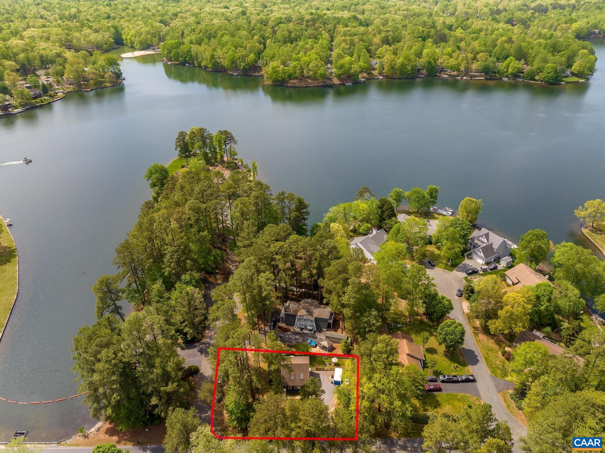 BEST DEAL at LAKE MONTICELLO- MOVE-IN READY - Sparkling & CHARMING Home LIVES SO BIG and offers amazing Lake VIEWs from almost every room just minutes from the Lake Monticello Marina and Main Gate?BRING your kayaks, Swim Trunks and enjoy LAKE lifestyle! This 3-bedroom, 2.5-bath New England S tyle home offers the best of many worlds?comfort, character, and convenience. The semi-open floor plan is perfect for everyday living and entertaining, featuring main-level living with a primary bedroom suite, a vaulted ceiling, and a dramatic floor-to-ceiling brick fireplace that anchors the space beautifully. The fully renovated eat-in kitchen shines with brand-new stainless steel appliances, granite countertops, freshly painted cabinets, and a newly added breakfast bar?perfect for casual dining or gathering with friends and family.Step outside to the fully redone rear deck, which leads to a private, fully fenced backyard?ideal for relaxing, entertaining, or pets. All of this paired with  stunning seasonal view and close proximity to Lake Monticello amenities makes this home a true standout. Ample Room for Parking & So Much MORE! Make it Yours To Own & Enjoy. WELCOME HOME to Lake Monticello!,Granite Counter,Painted Cabinets,Fireplace in Living Room