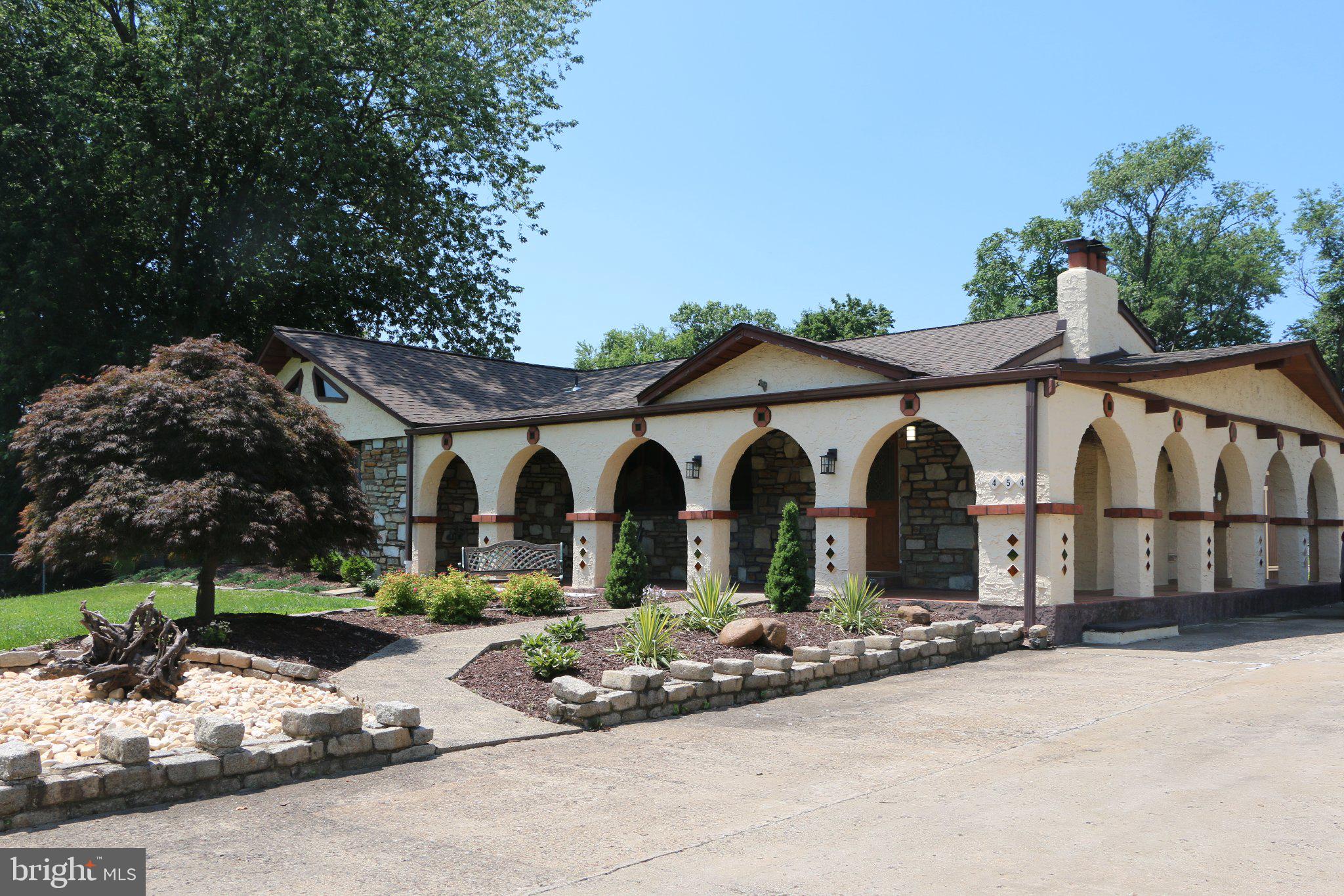 Welcome to this truly one-of-a-kind ranch home offering 5 spacious bedrooms, 2.5 bathrooms, and an oversized lot with endless possibilities. From the moment you arrive, you'll appreciate the expansive front yard and inviting curb appeal.

Step inside to a bright and welcoming living room featuring beautiful hardwood floors, a cozy fireplace, and picturesque views of the front lawn. The well-appointed kitchen is designed for both everyday living and entertaining, complete with granite countertops, rich wood cabinetry, and brand-new stainless steel appliances.

Just beyond the kitchen, the sun-filled Florida room provides the perfect place to relax while offering seamless access to the private rear yard for indoor-outdoor living.

This home has been thoughtfully updated with major improvements, including a new roof on both the home and the two detached garages, a new water heater, and a new central air conditioning system, providing peace of mind for years to come.

Car enthusiasts, contractors, hobbyists, and anyone needing extra space will love the two oversized multi-car detached garages, ideal for vehicles, workshops, equipment, or additional storage. An extended driveway offers abundant off-street parking for multiple vehicles.

Conveniently located near parks, shopping, restaurants, and major commuting routes, this exceptional property combines space, functionality, and modern updates in a location you'll love. Don't miss this rare opportunity to make it your own!
