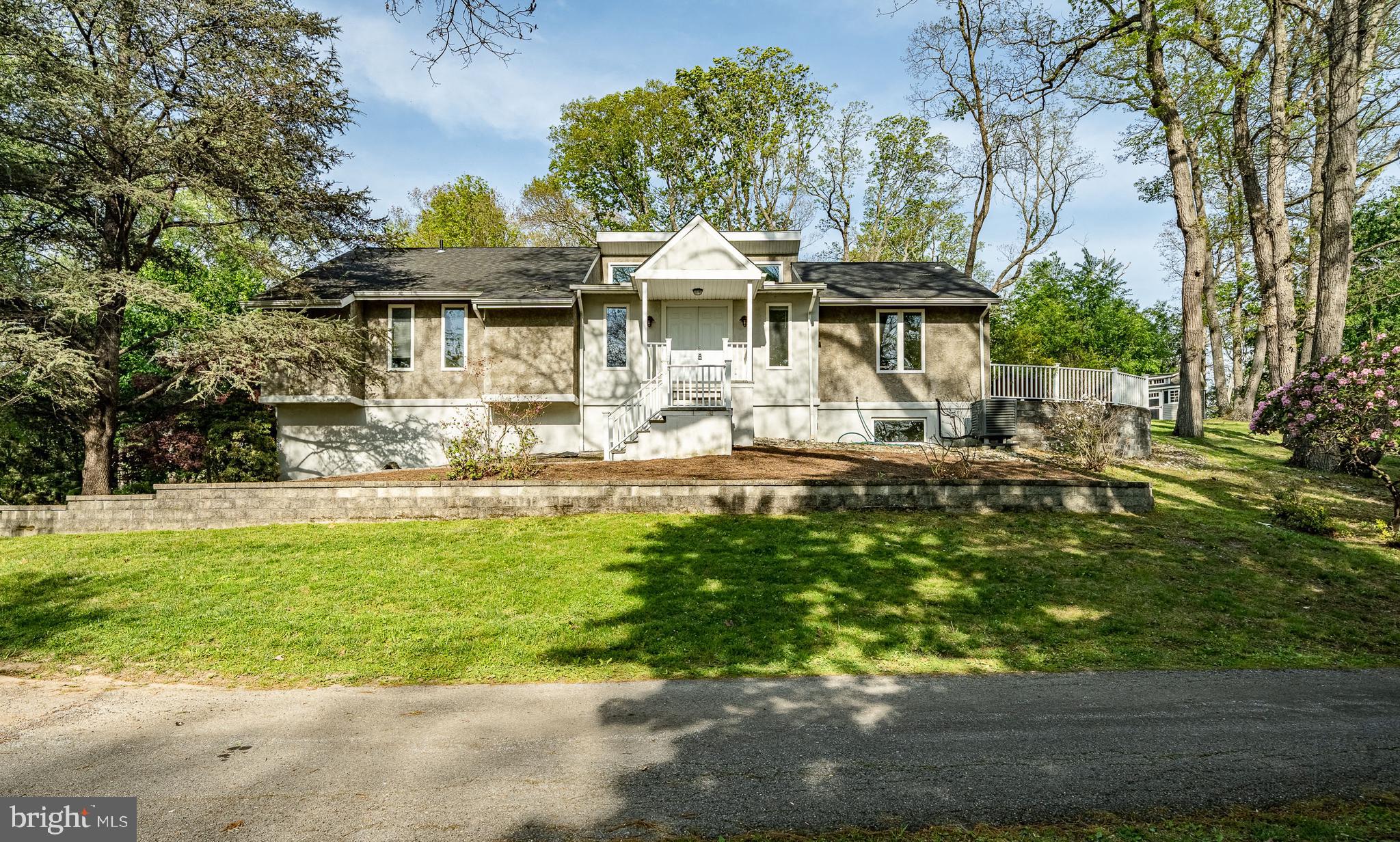 Nestled on a serene 1.5-acre lot, this charming detached contemporary  home seamlessly blends contemporary design with the warmth of a raised ranch. Built in 1979. Gutted and redone in 2004-2025, this residence boasts a timeless appeal. 2,271 square feet of thoughtfully designed living space, this home offers four spacious bedrooms and two full bathrooms, ensuring comfort for everyone. Step inside to discover a stunning  living room with vaulted ceilings, highlighted by a two story fireplace, perfect for gathering with loved ones on chilly evenings.  An additional great room with vaulted ceilings was added.   The fully finished basement, complete with garage access and a workshop, provides endless possibilities—whether you envision a recreational space, a home office, or a creative studio. The attached oversized garage accommodates two vehicles, while the expansive driveway offers ample parking for guests. Enjoy the convenience of interior access from the garage, making daily routines a breeze. Outside, the generous lot provides a private oasis for outdoor activities over looking a small pond, gardening, or simply unwinding in nature. The peaceful surroundings create a perfect backdrop for creating lasting memories. This home is not just a place to live; it’s a sanctuary where comfort meets functionality. Experience the perfect blend of space, style, and serenity—your dream home awaits!