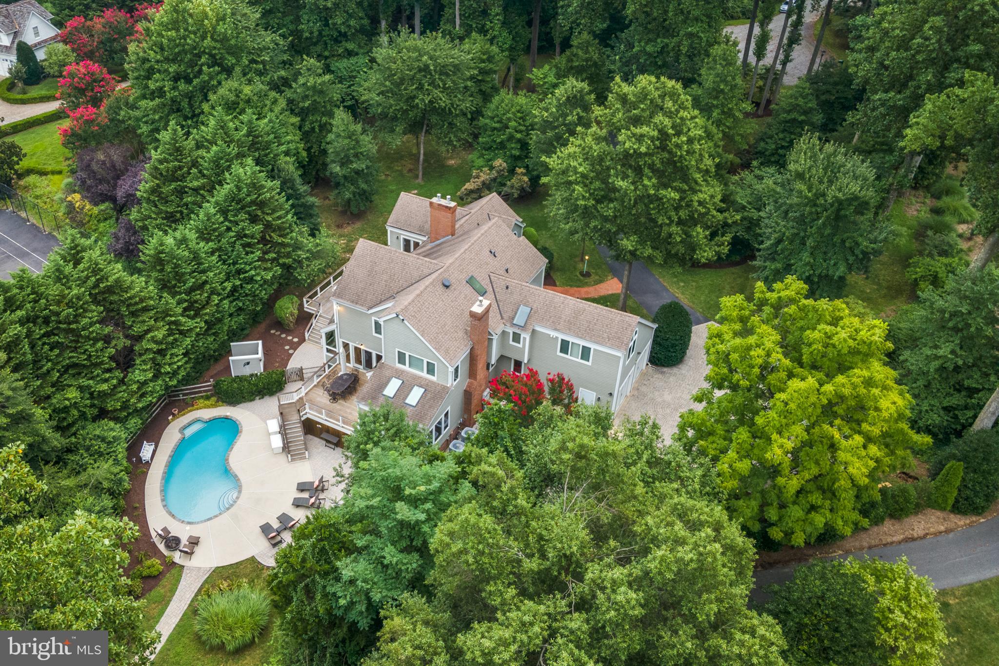 Elevated  waterfront with deep water,  heated salt water pool and extremely well maintained custom built Post and Beam home sits on a private 1.65 acres  site  minutes from the heart of Annapolis!  The private deepwater pier features 3  slips (8-9 feet mlw), one with a 16,000 lb lift and  recent rip-wrap on protected Crab Creek. Three finished levels will accommodate a large numbers of guests or in laws with  5 Bedrooms , 4.5 Baths and approximately 5800 square feet, 3 brick FPs, wood floors, open floor plan, Ipe decks,1st floor primary suite & tranquil water views. Privacy, specimen trees and lush landscaping. Roof, hardiplank exterior and windows all replaced in 2012. Whole house generator.  Gracious home is perfect for  entertaining! Ideally located minutes from downtown Annapolis, and quick access to BWI, DC and Baltimore. Welcome home to Hollygate!